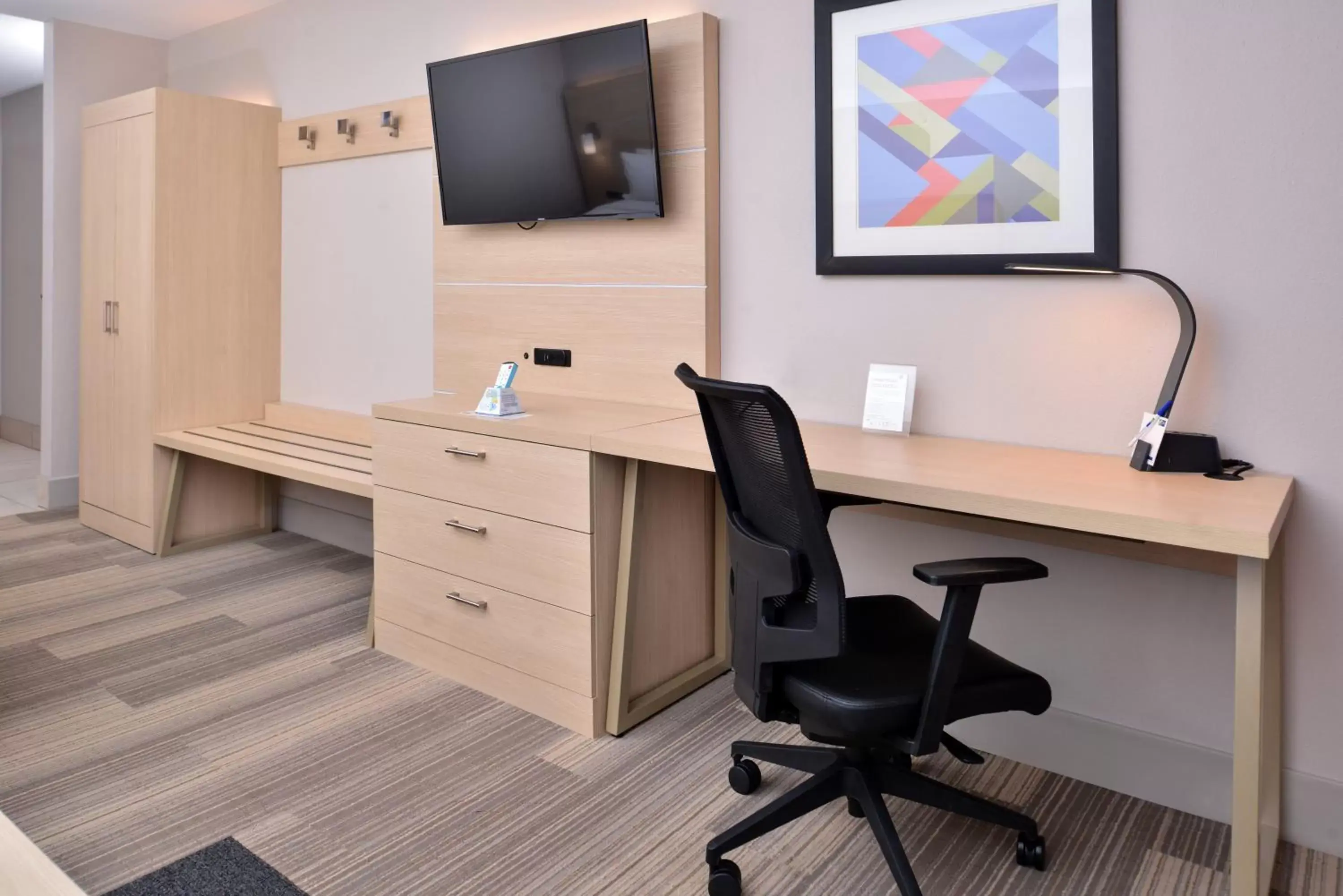 Photo of the whole room, TV/Entertainment Center in Holiday Inn Express Hotel & Suites Cincinnati - Mason, an IHG Hotel