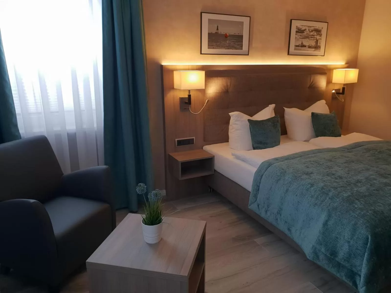 Photo of the whole room, Bed in Mertinkus Nordseehotel