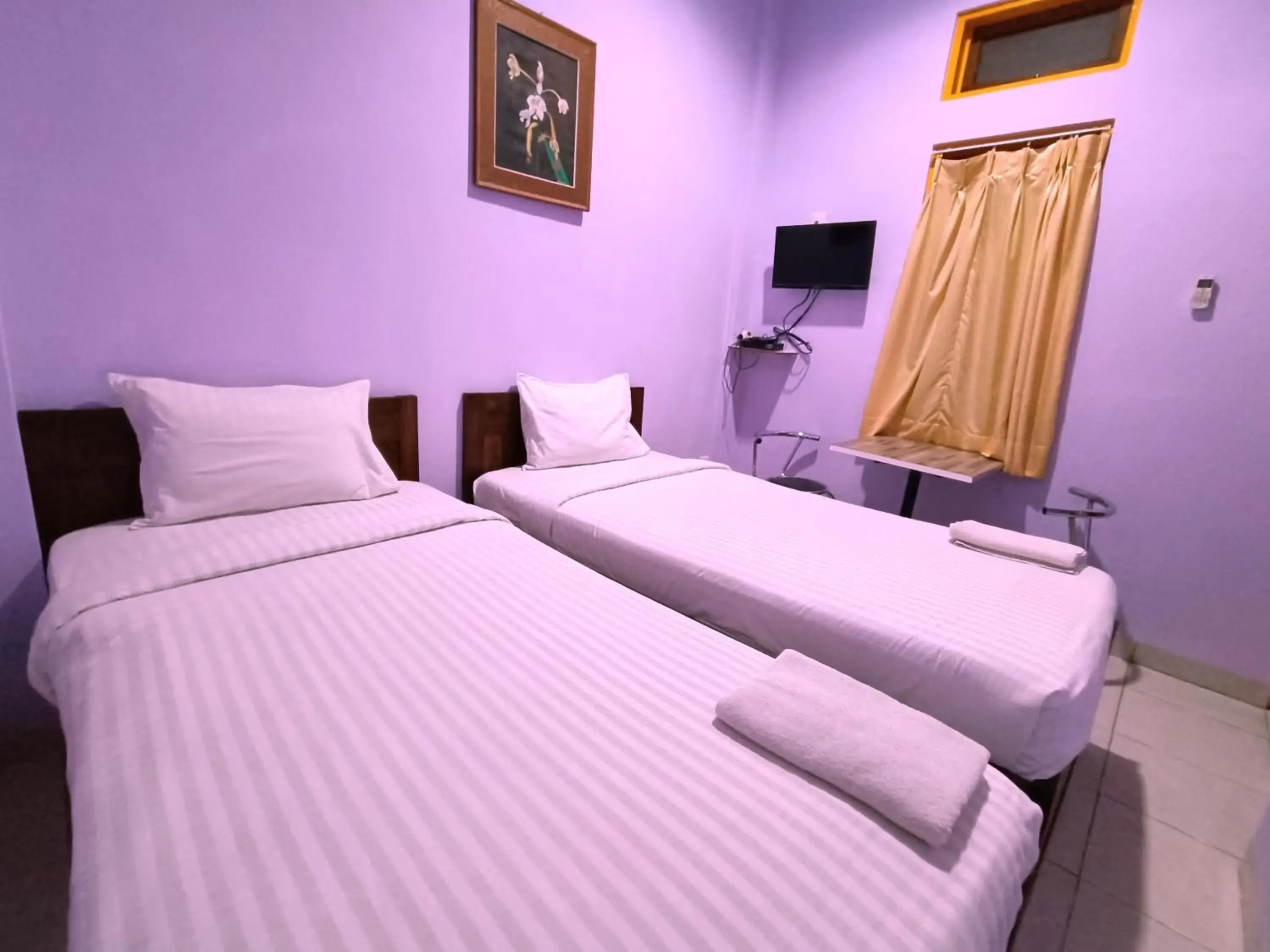 Bed in Wisma Mutiara Hotel