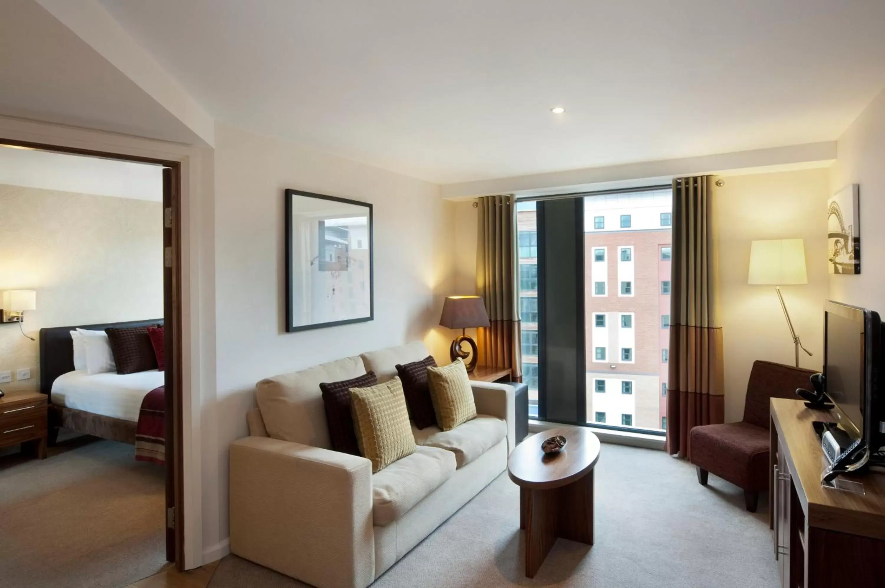 Bedroom, Seating Area in Staybridge Suites Newcastle, an IHG Hotel
