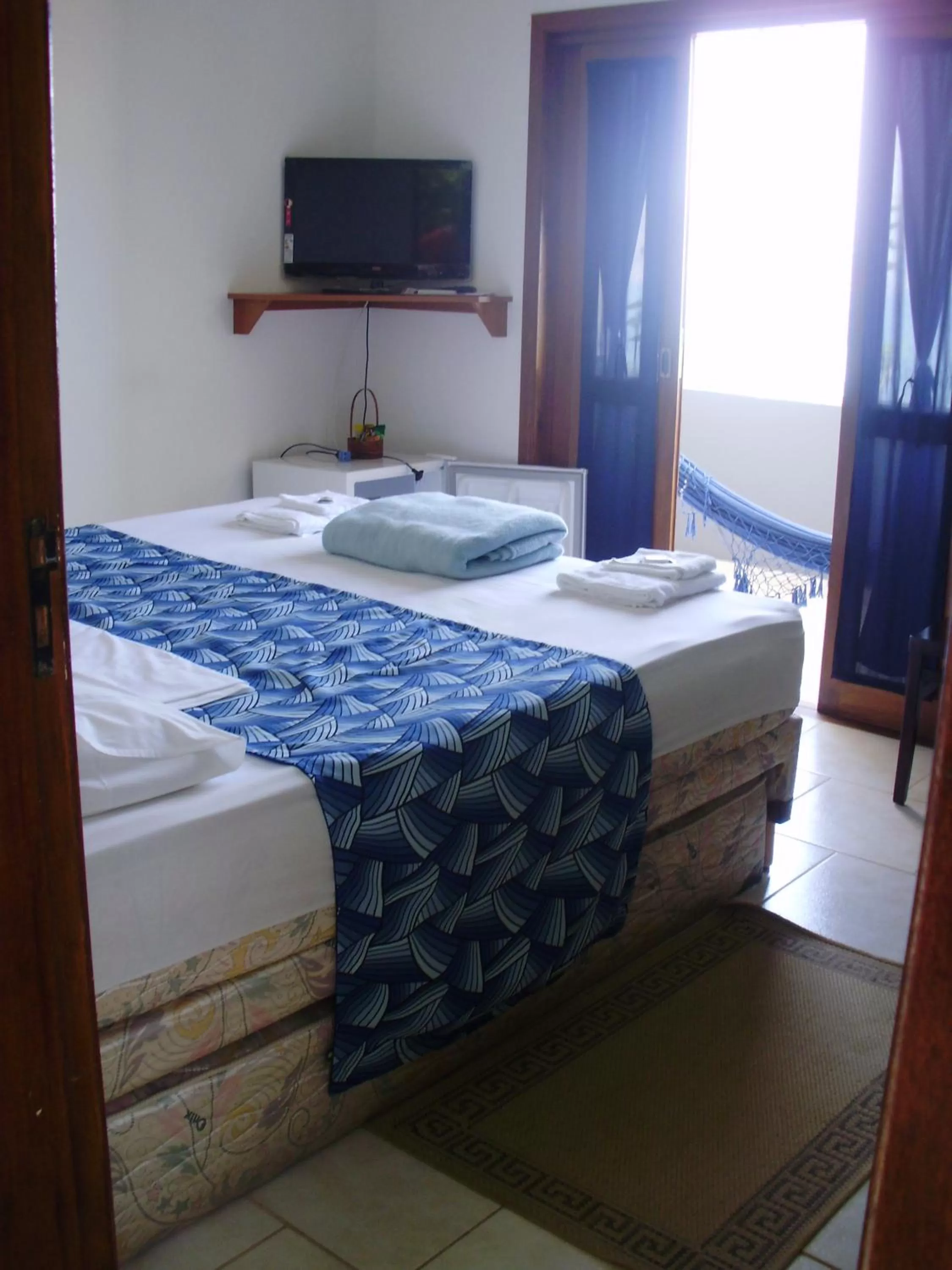 Bed in Pousada Piquara