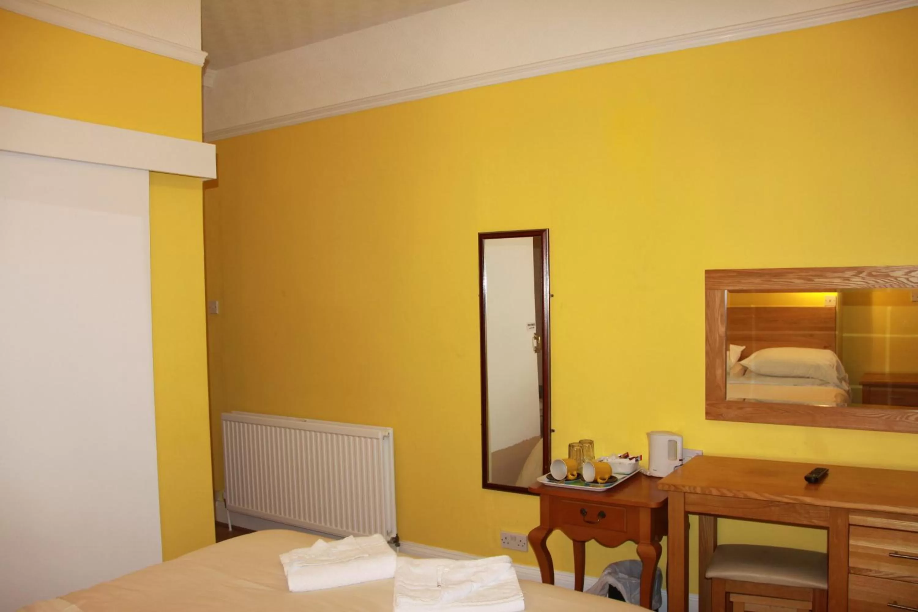 Bed in Ambassador Hotel