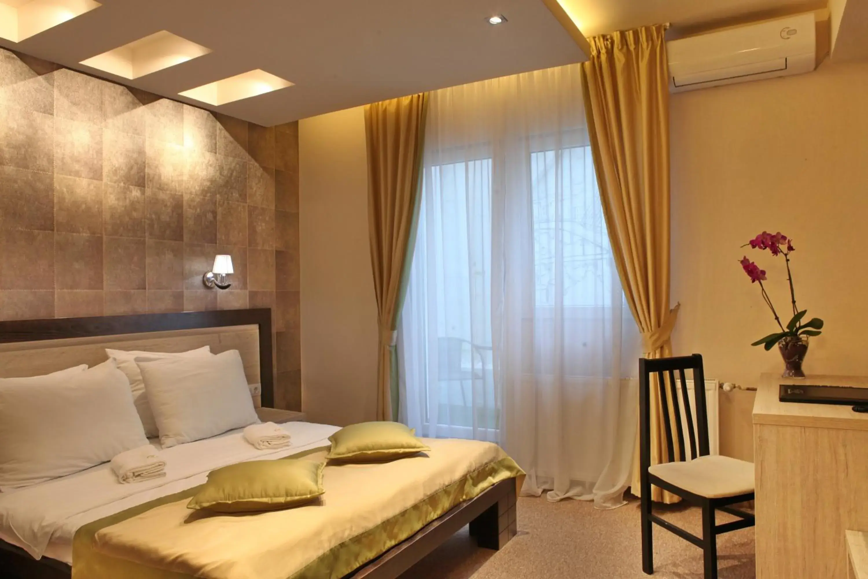 Bed in Garni Hotel Vozarev