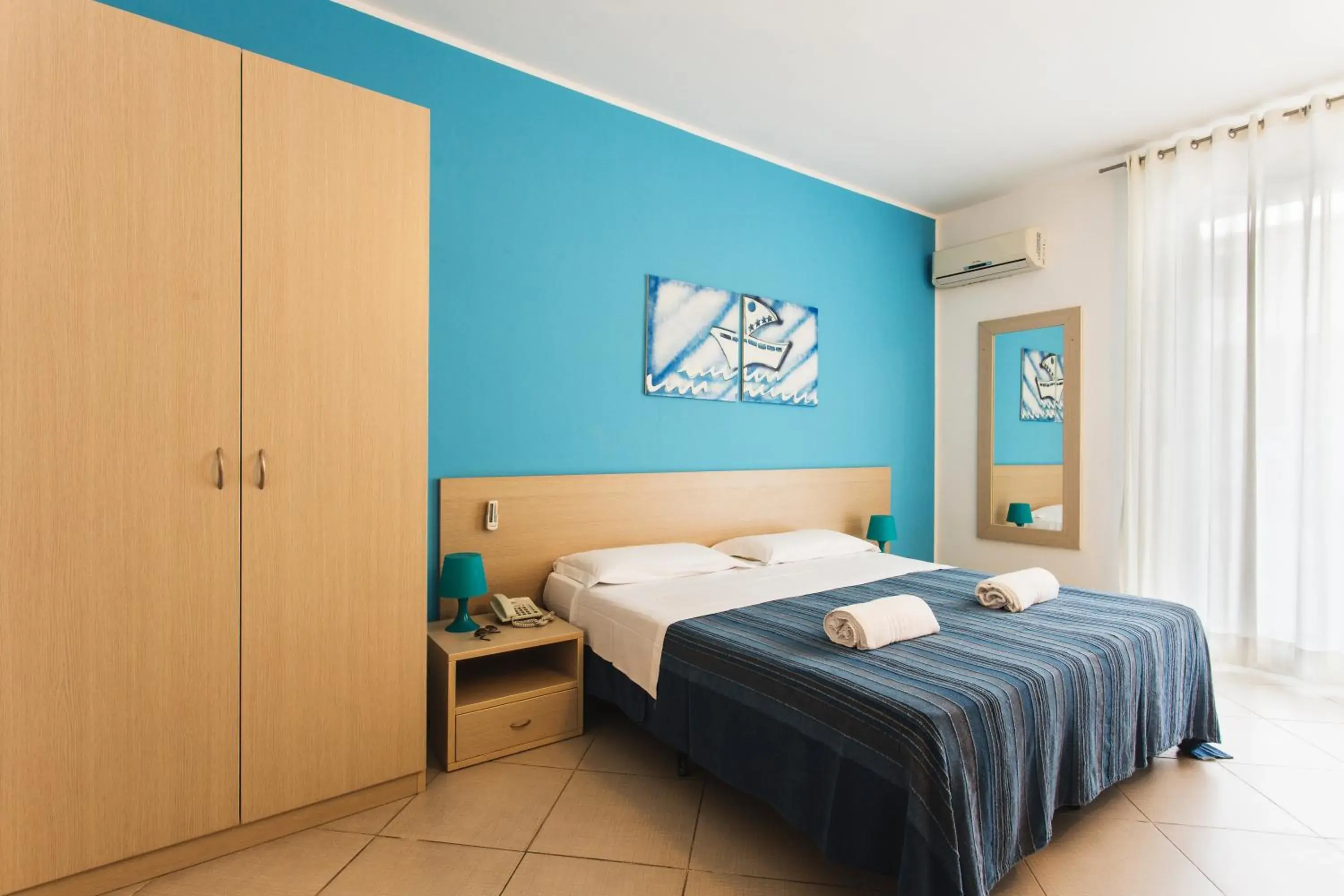 Bed in Hotel Baia Del Sole