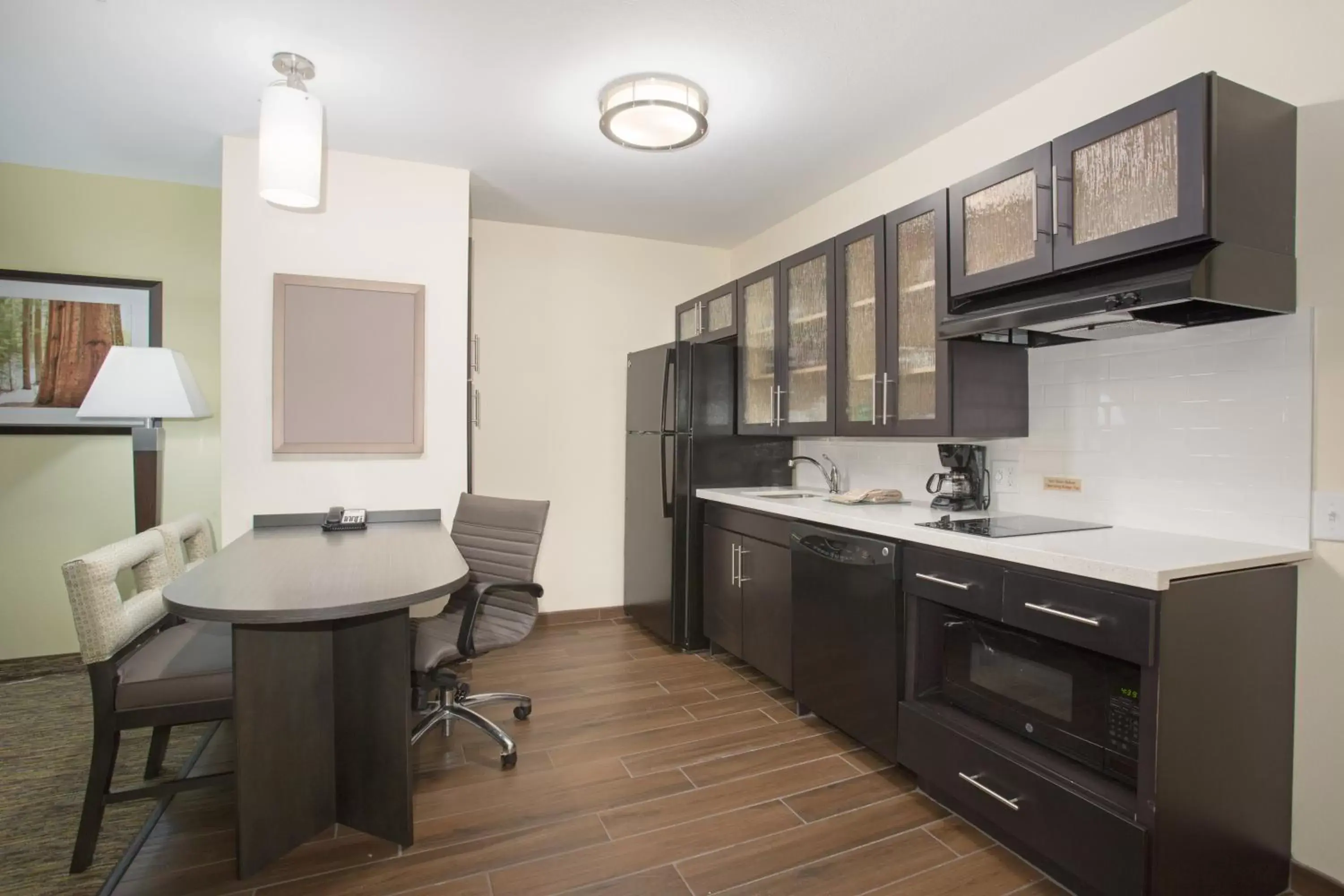 Photo of the whole room, Kitchen/Kitchenette in Candlewood Suites Longmont, an IHG Hotel