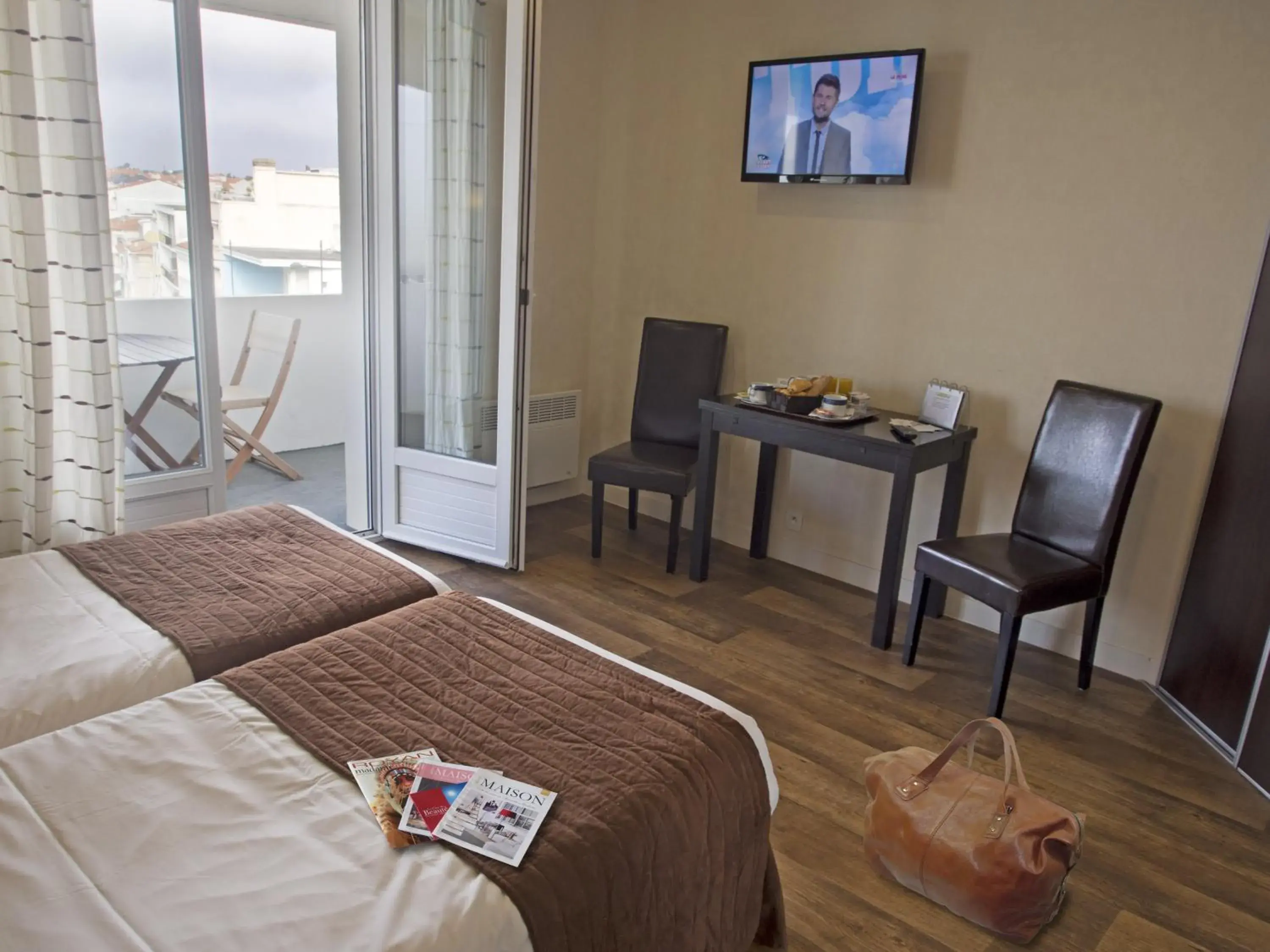 Photo of the whole room, TV/Entertainment Center in Hotel Belle Vue Royan