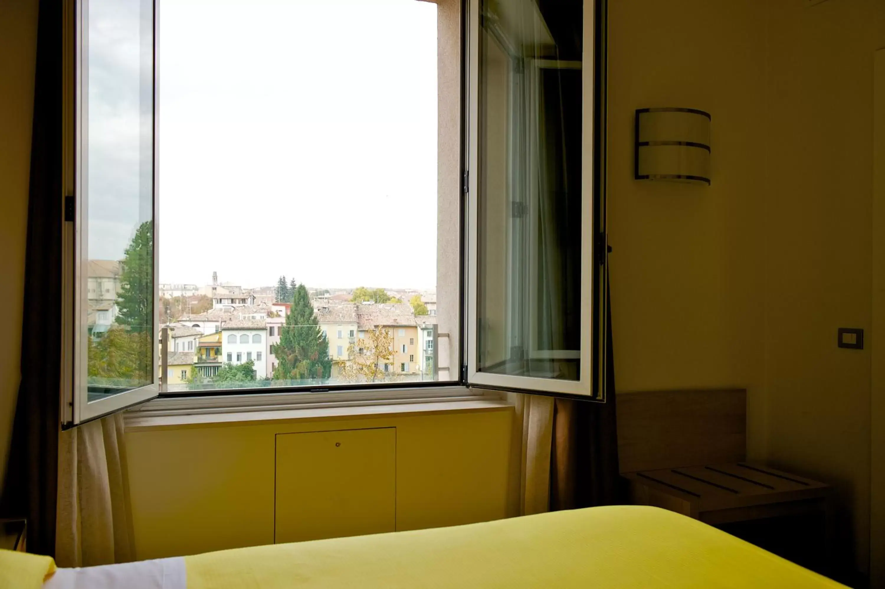 River view, Bed in Ibis Styles Parma Toscanini River view, Bed in Ibis Styles Parma Toscanini