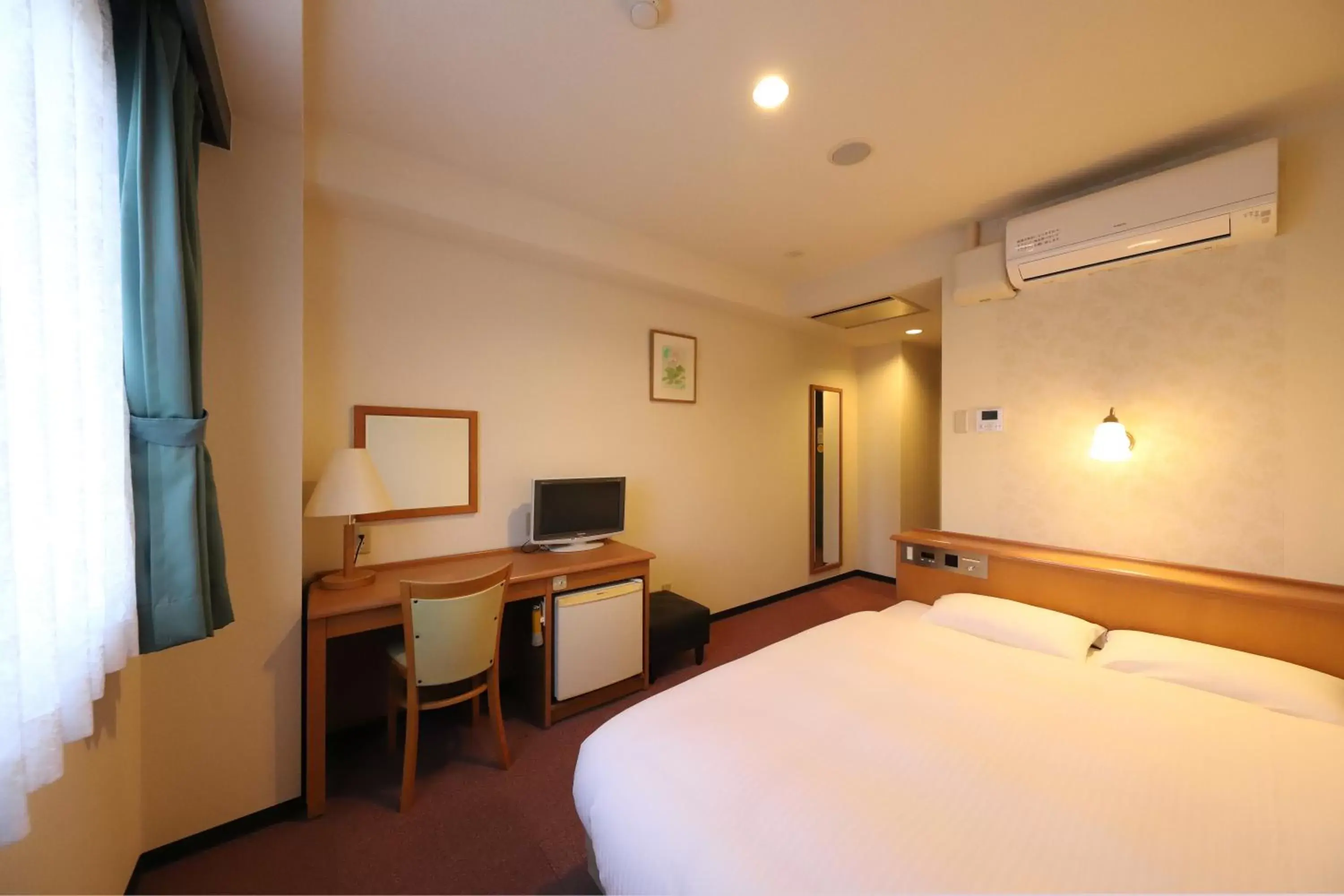 Bed in Smile Hotel Takaoka Ekimae