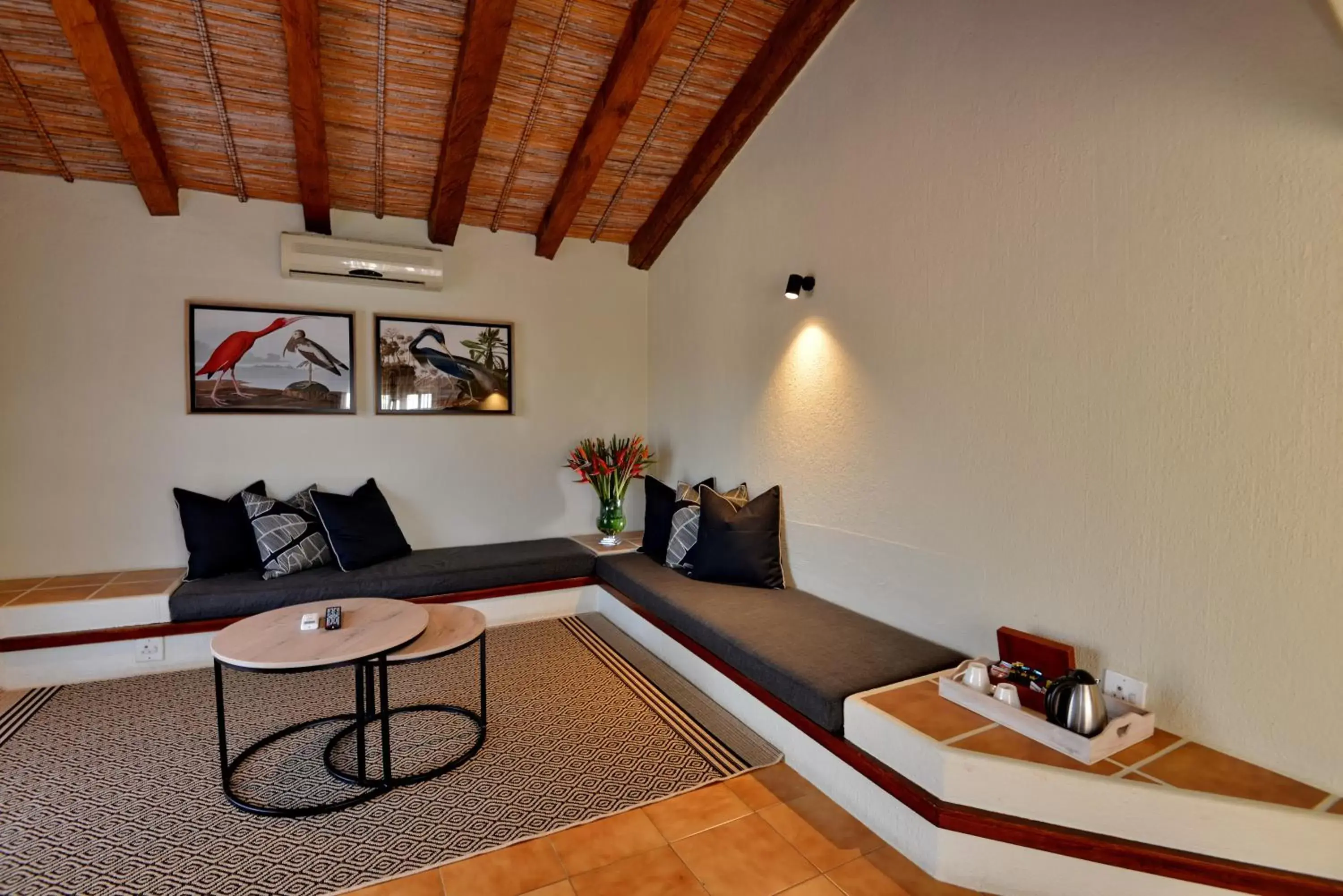 Seating area, Bed in ANEW Resort Hazyview Kruger Park Seating area, Bed in ANEW Resort Hazyview Kruger Park