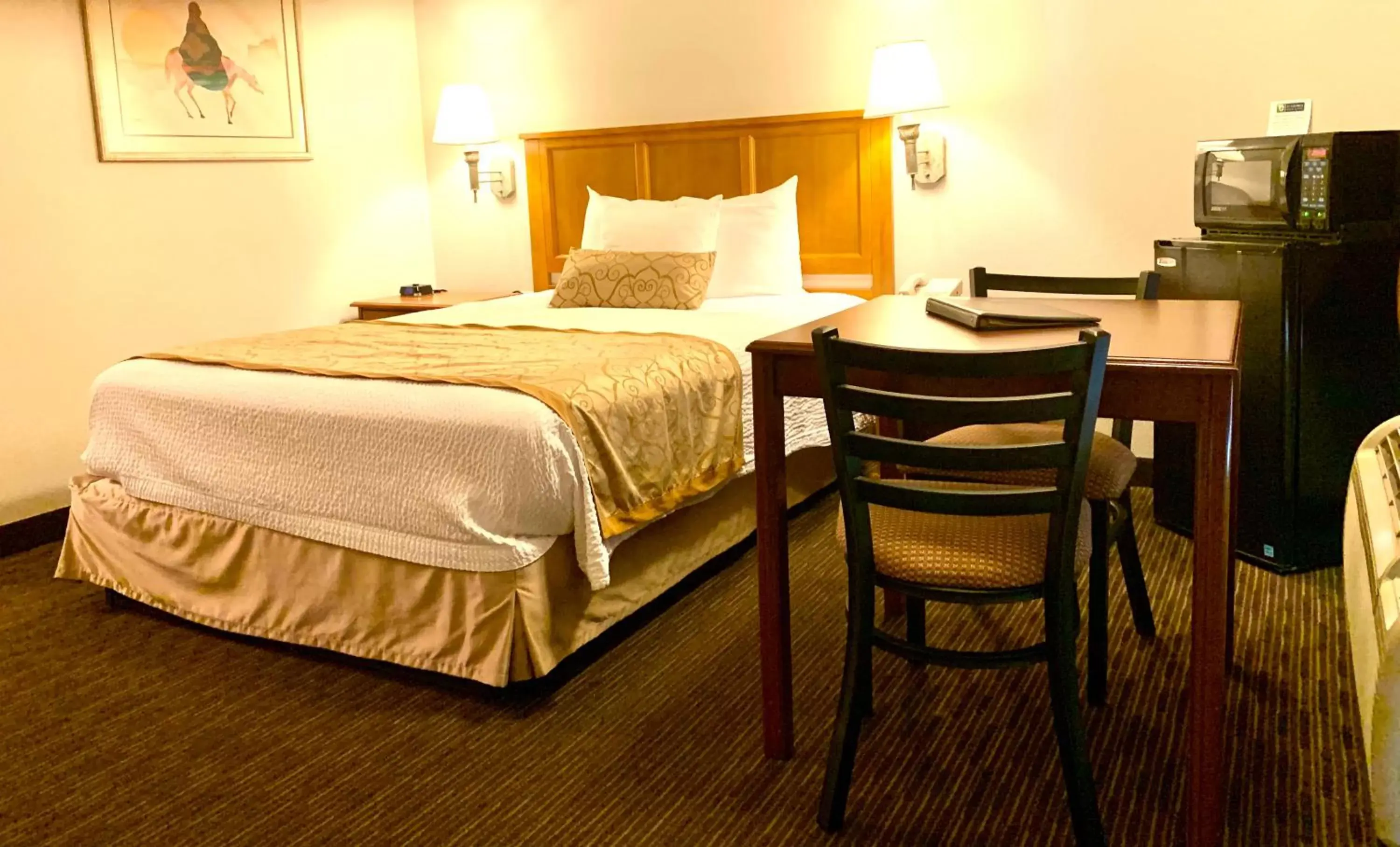 Bed in St. George Inn and Suites