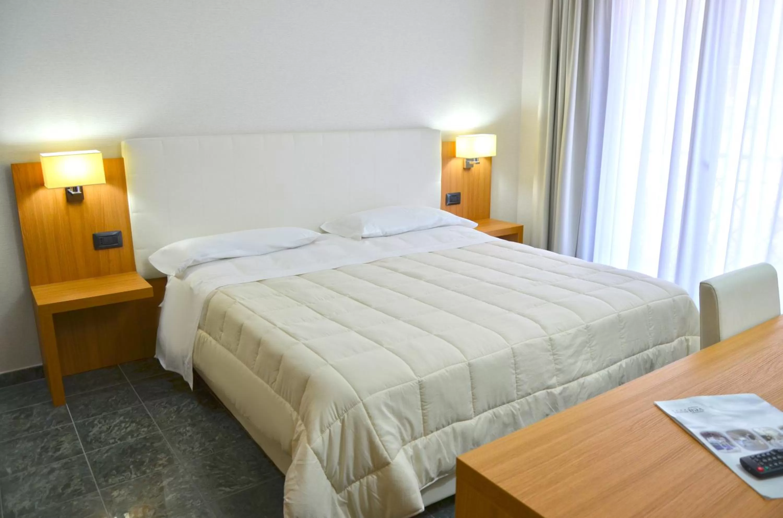 Bed in Vea Resort Hotel