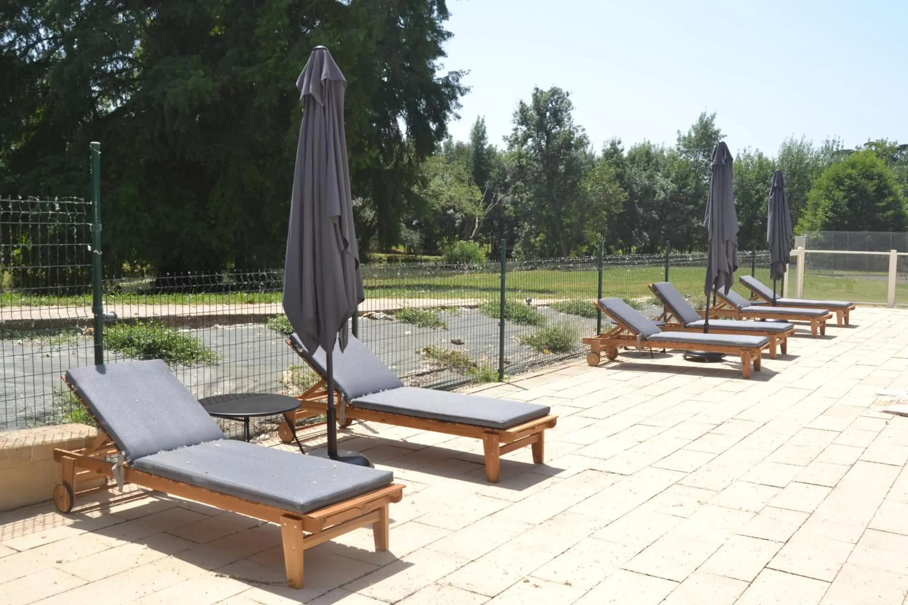 Swimming pool in Logis Château Saint Marcel