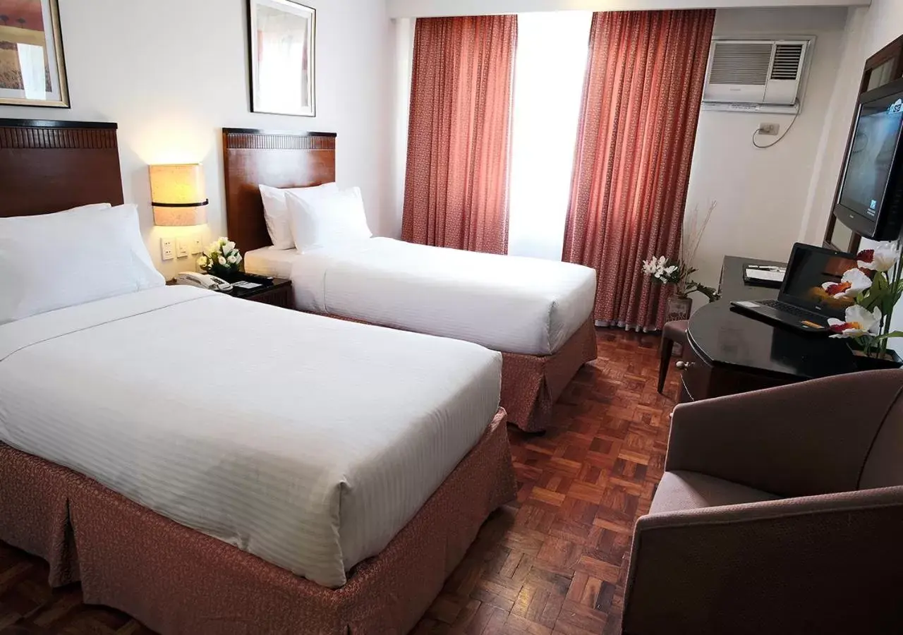 Bed in Fersal Hotel Neptune Makati