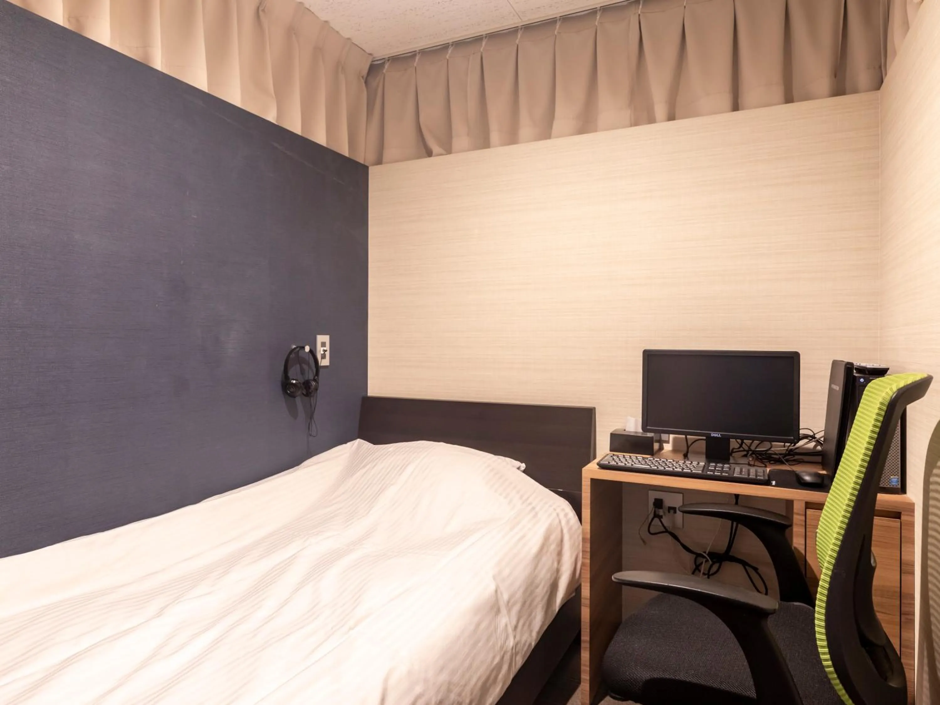 Bed in Tabist Hotel Smart Sleeps Oita Station