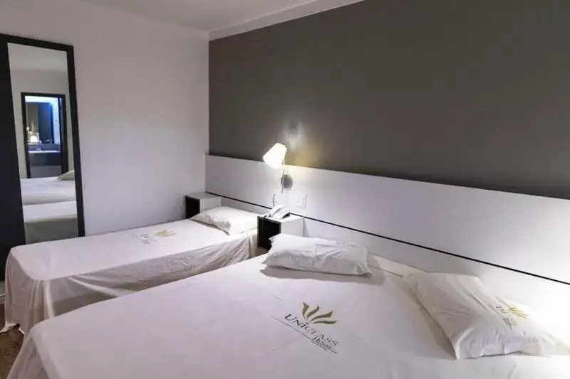 Bed in Uniclass Hotel Pinheiros