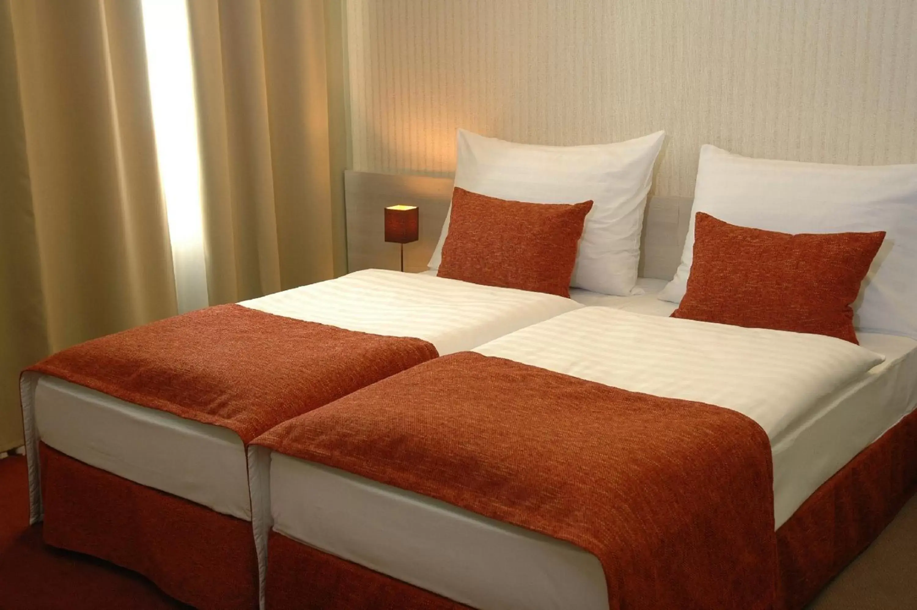 Bed in Star City Hotel