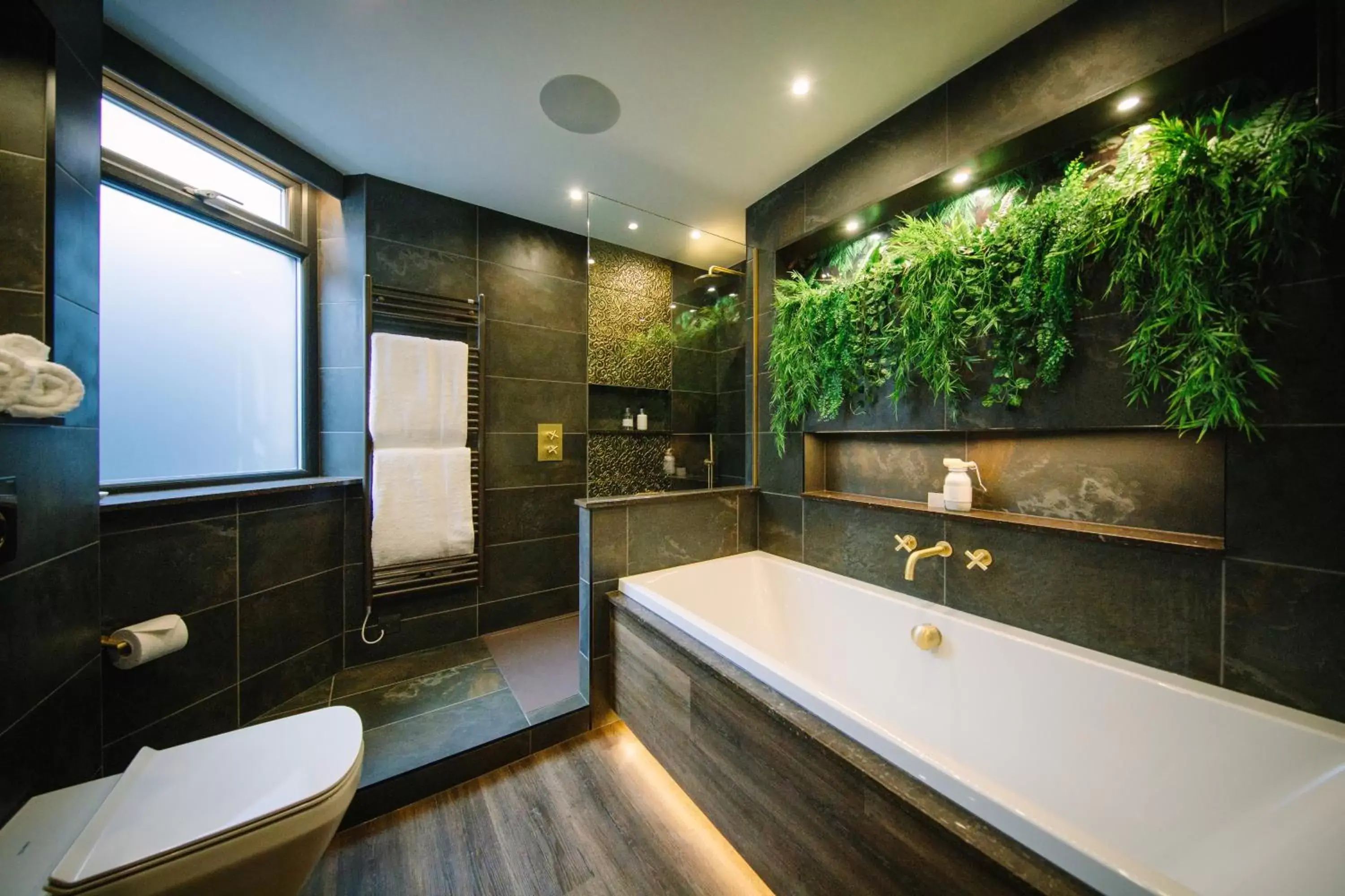 Bathroom in Absoluxe Suites