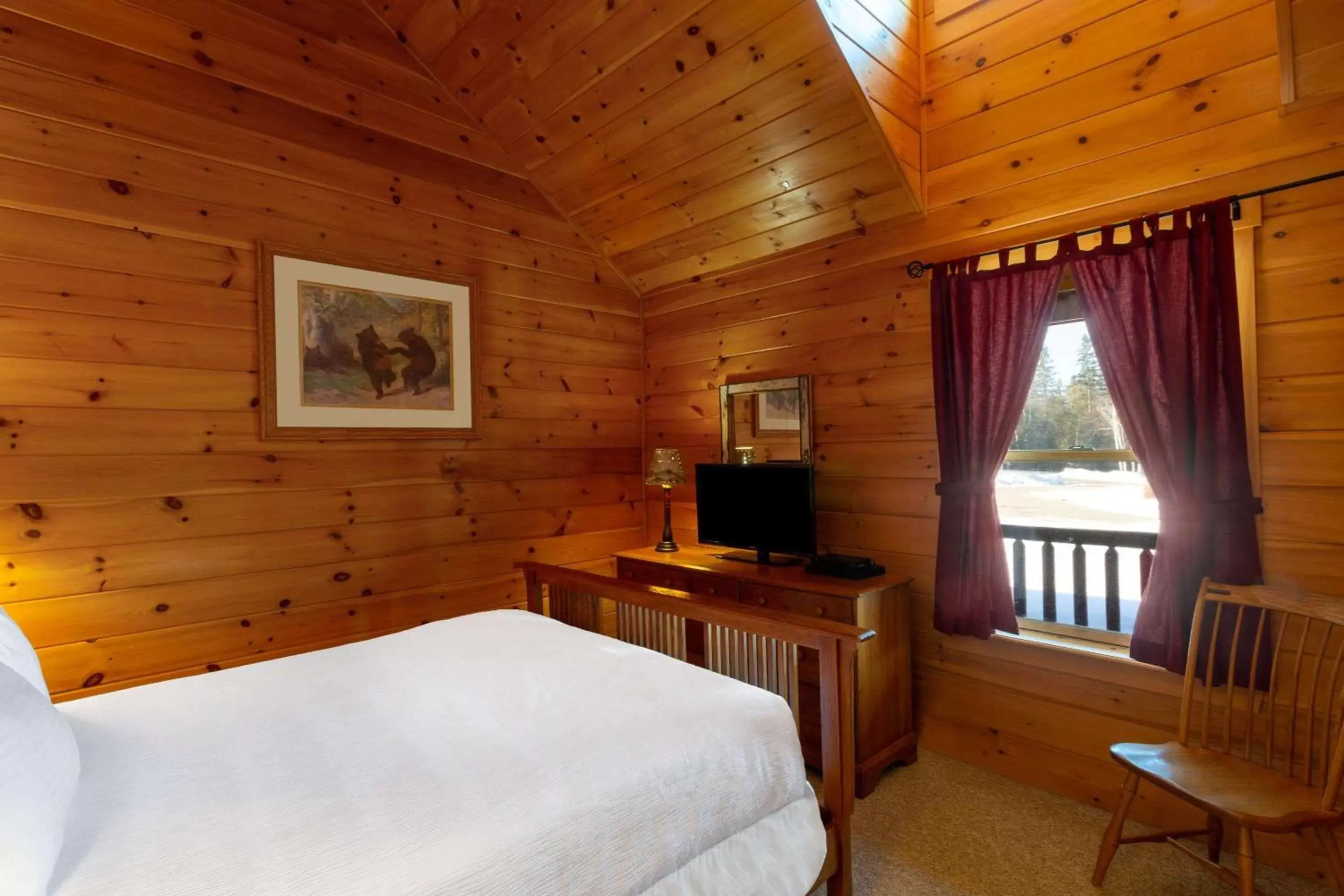 Bed, TV/Entertainment Center in Rangeley Lake Resort a Ramada by Wyndham