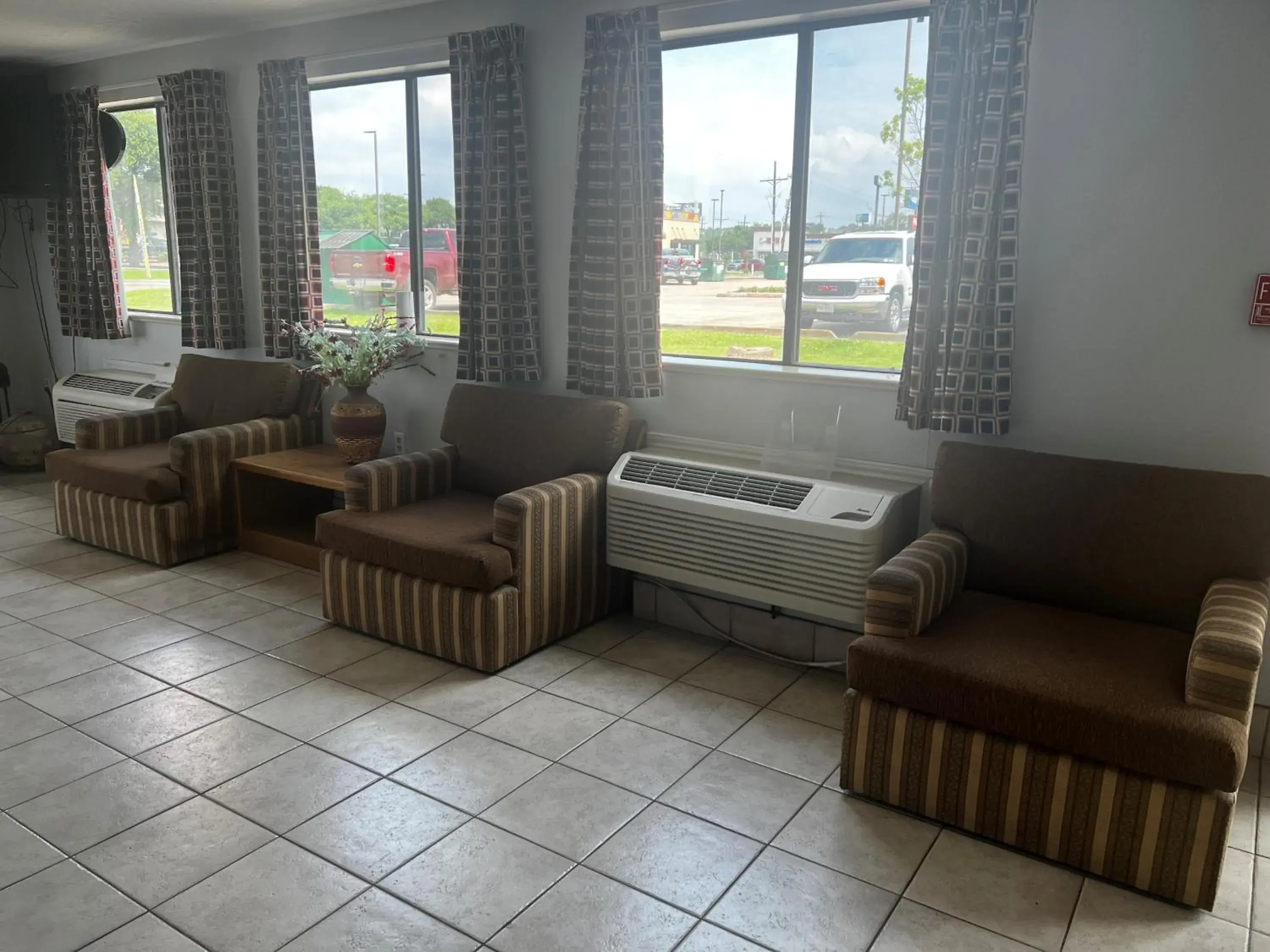 Lobby or reception in Super 8 by Wyndham Cleveland TX Lobby or reception in Super 8 by Wyndham Cleveland TX