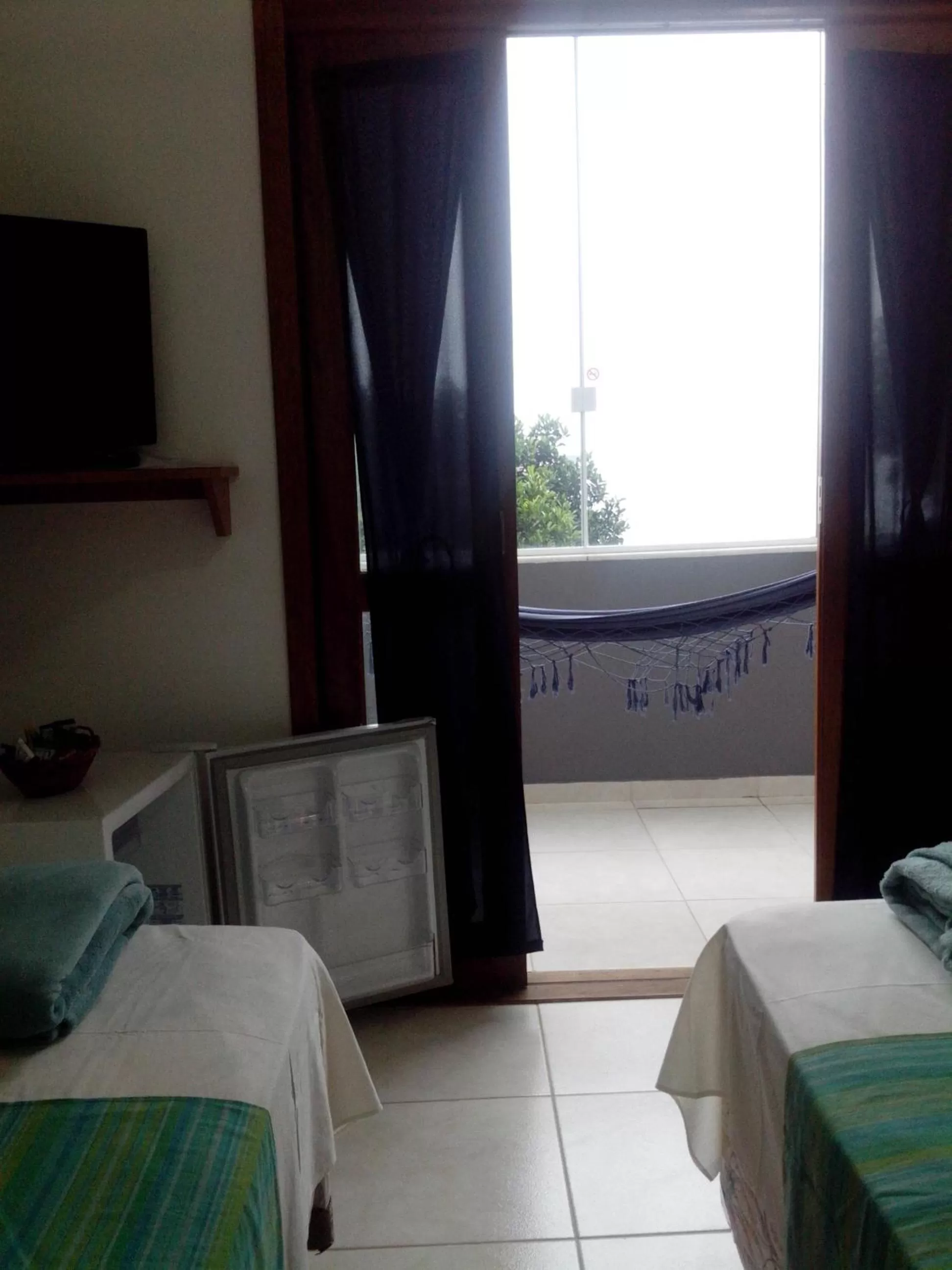 Bed in Pousada Piquara