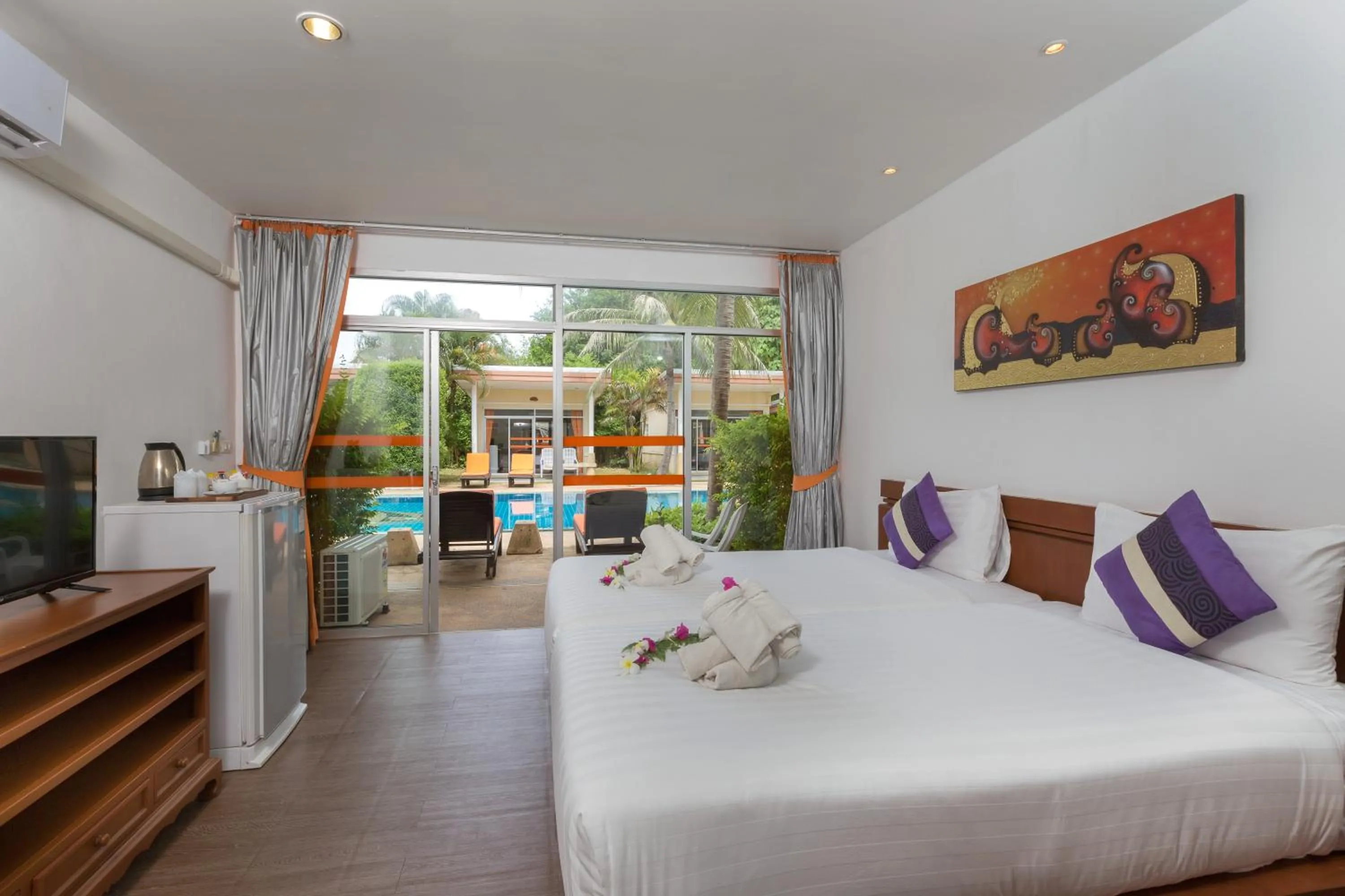 Pool view, Bed in Phuket Sea Resort SHA Extra Plus