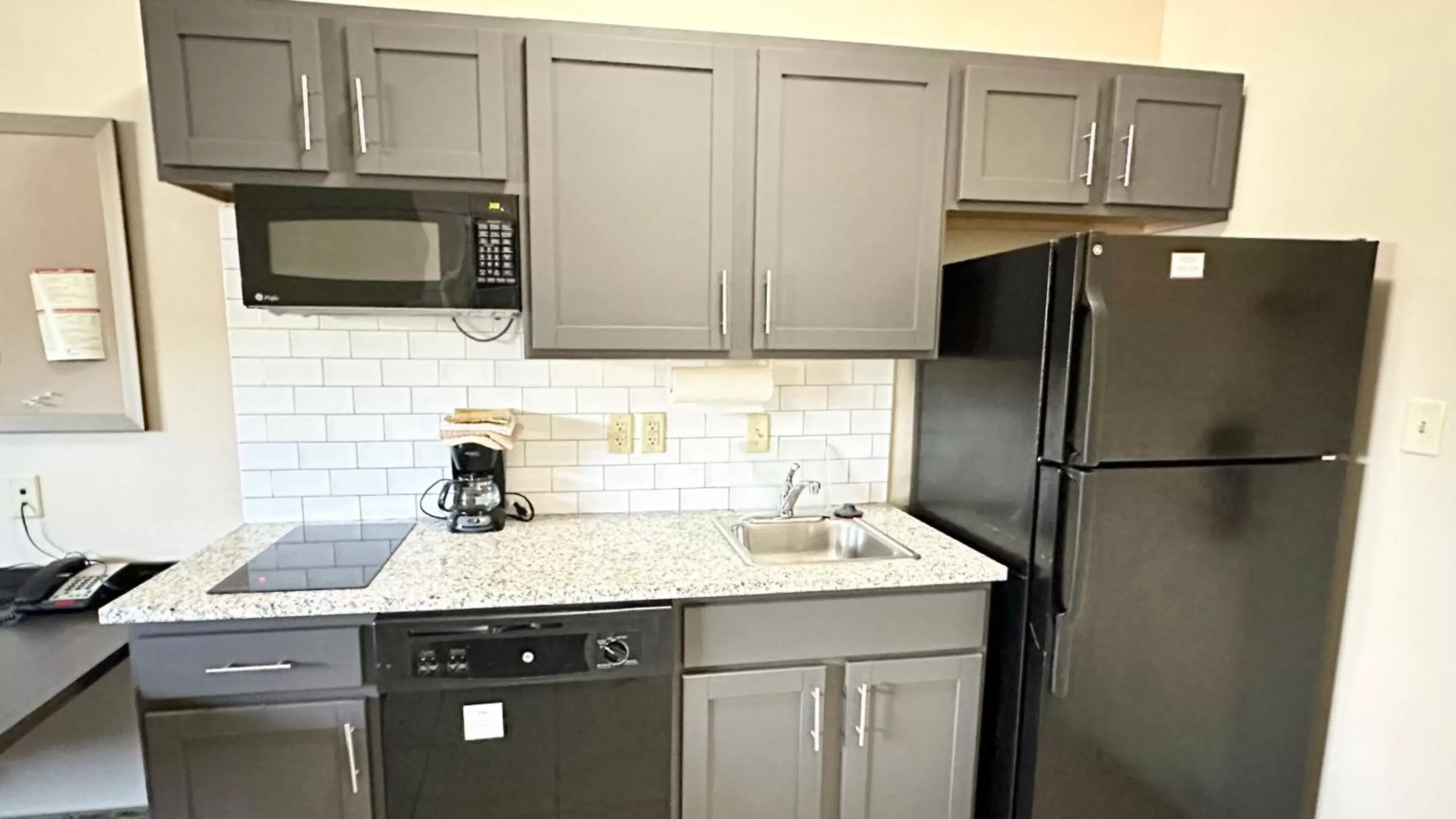 Kitchen or kitchenette, Kitchen/Kitchenette in Candlewood Suites South Bend Airport, an IHG Hotel