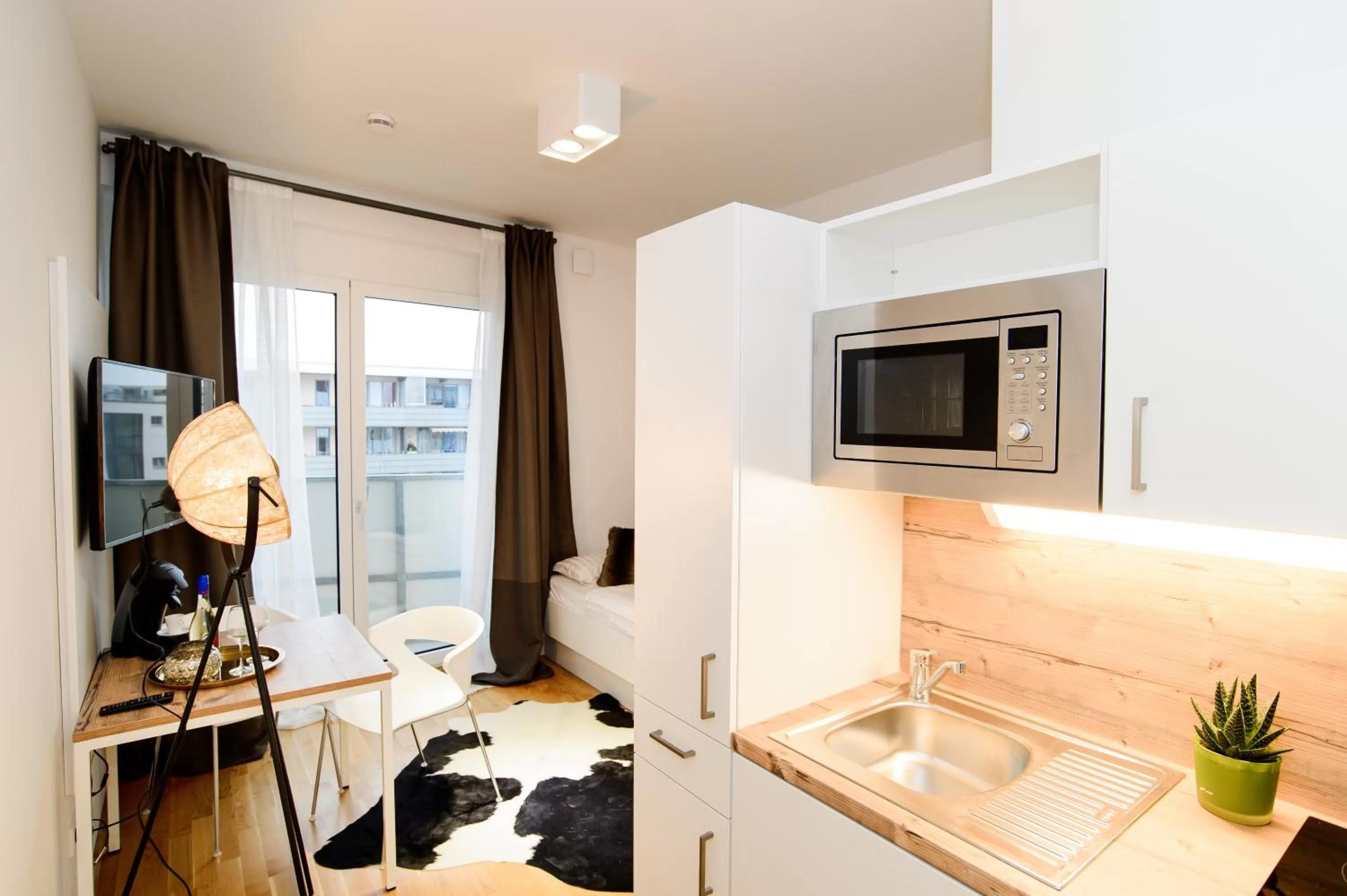 Kitchen or kitchenette in Aparthotel my room - Messe Munich