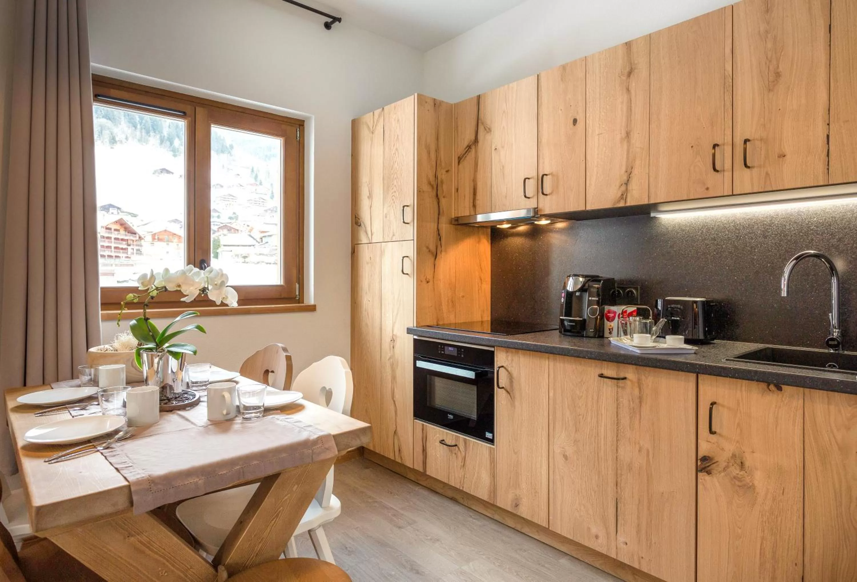 Kitchen or kitchenette in Résidence Club MMV La Clé des Cimes