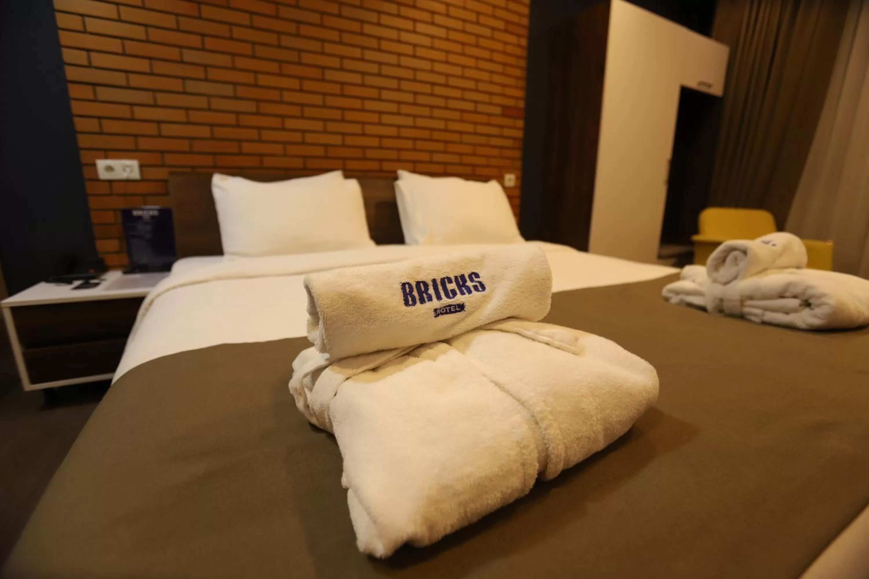 towels, Bed in Bricks Hotel