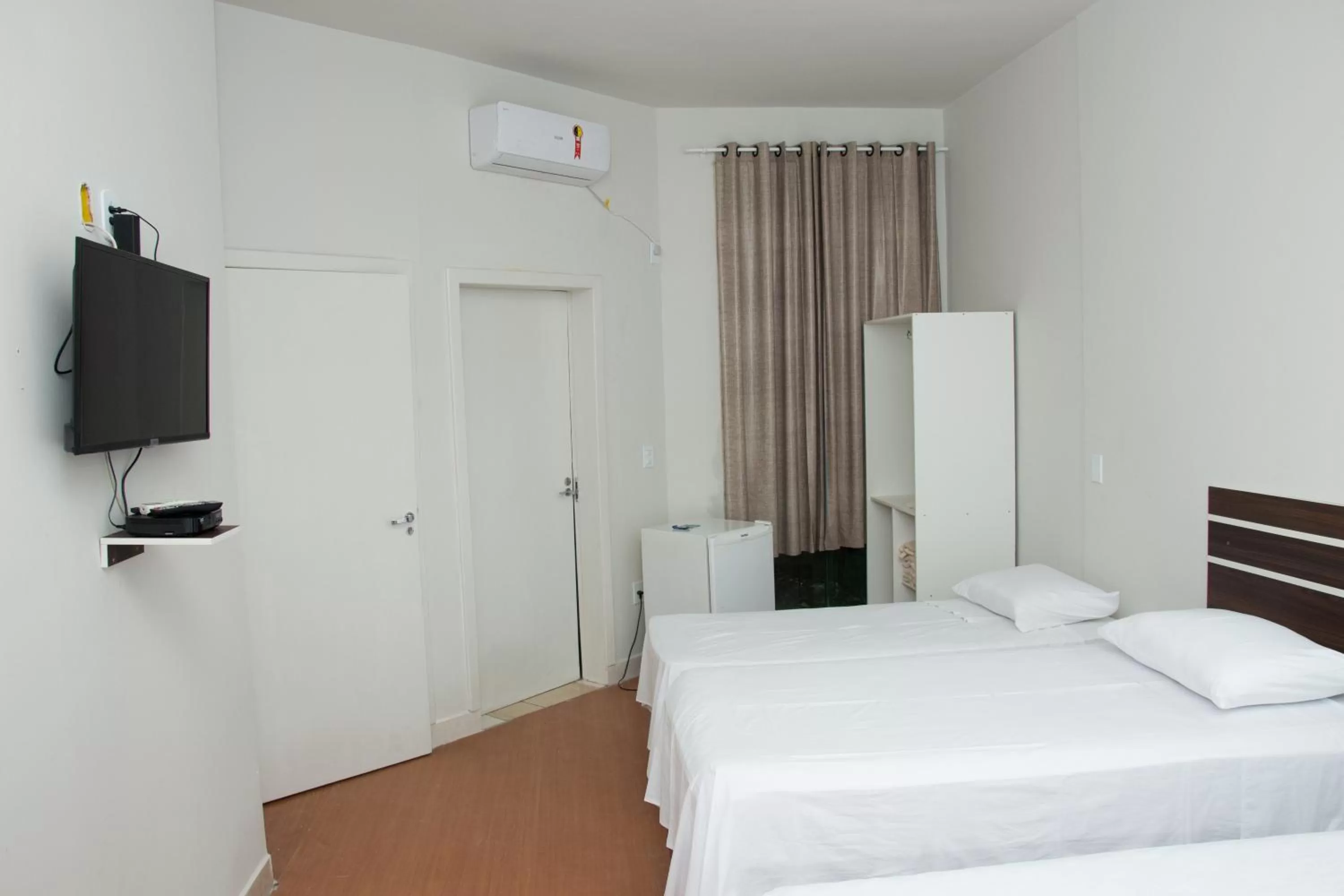 Bed in SAMIR HOTEL COMFORT