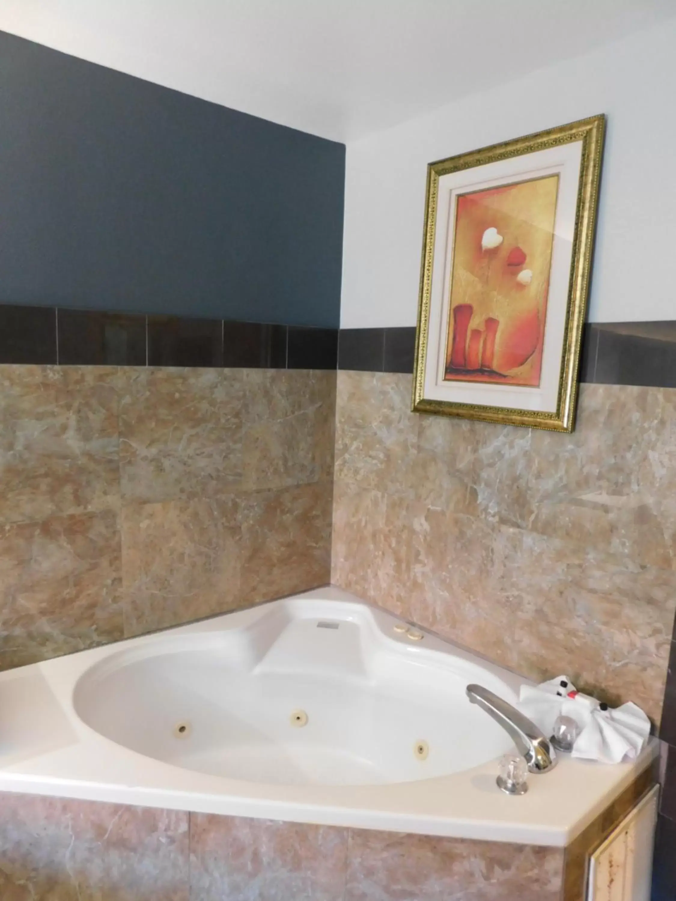 Bathroom in Days Inn & Suites by Wyndham Downtown Gatlinburg Parkway