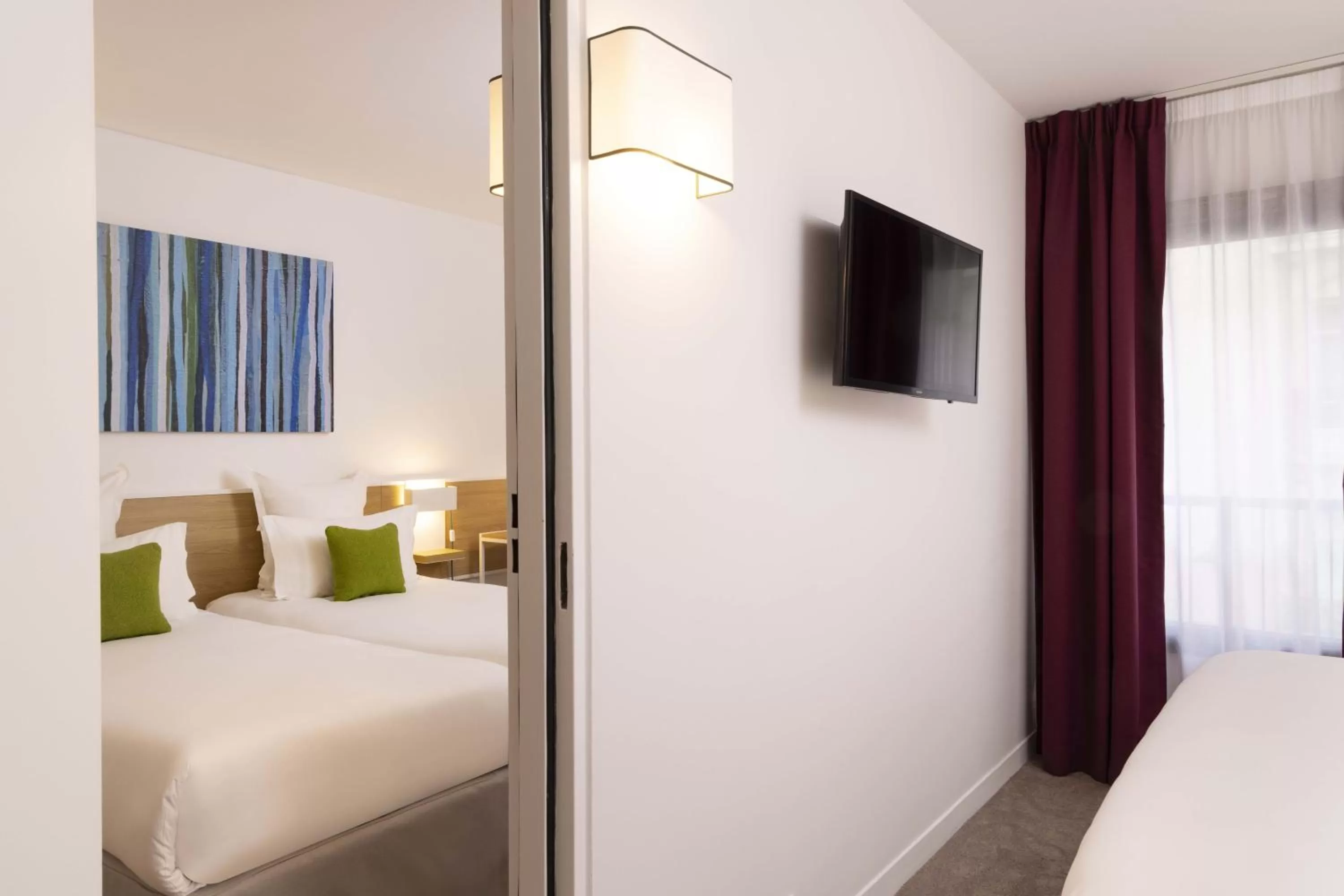 Bed in Hotel Paris Louis Blanc