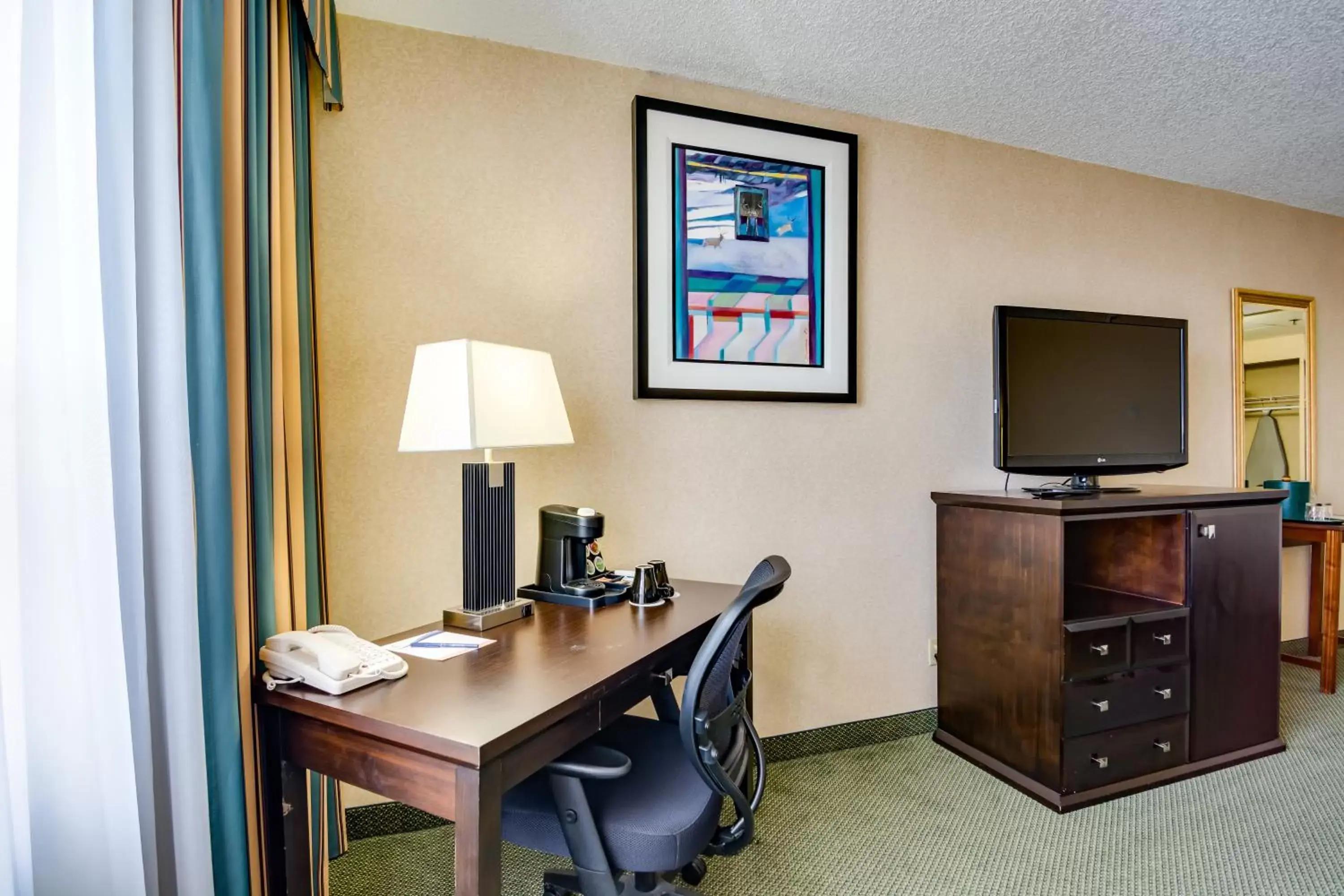 Photo of the whole room, TV/Entertainment Center in Sawridge Inn and Conference Centre Edmonton South