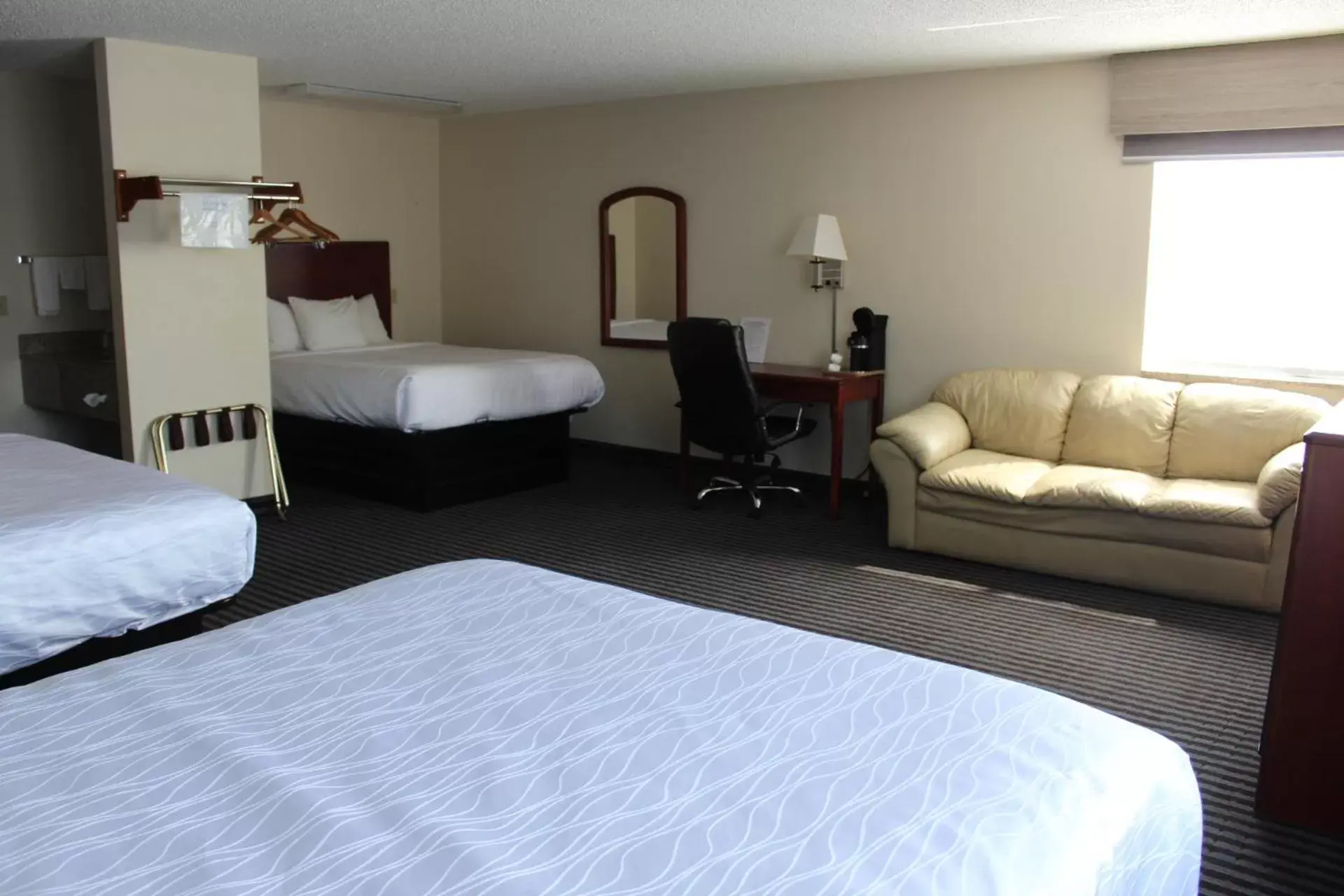 Bed in Reston Inn & Suites