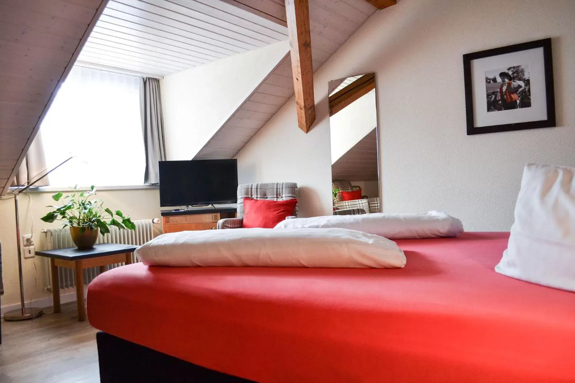 Photo of the whole room, Bed in Hotel Landhaus Säntis Herisau