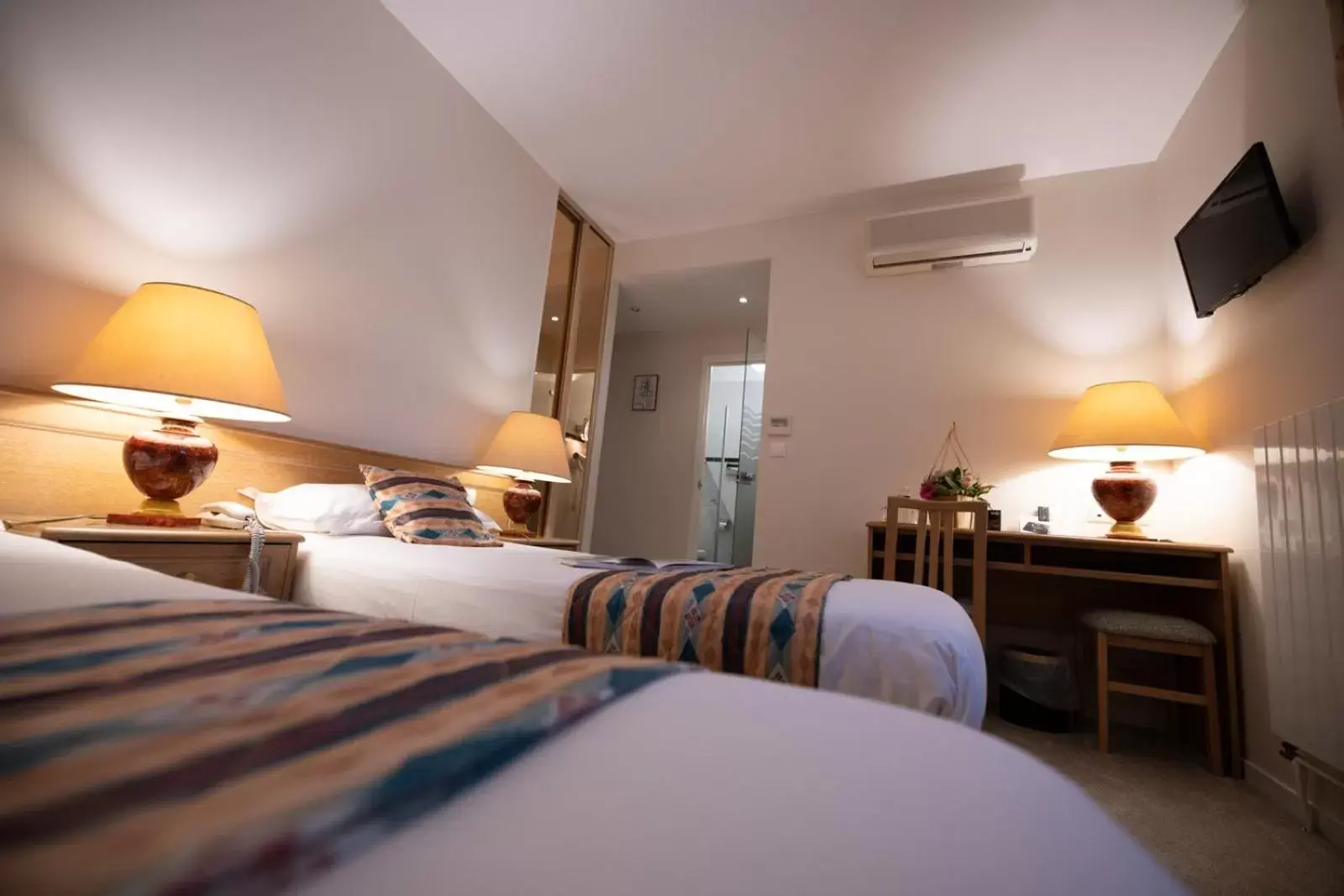 Bed in Logis Hotel Le Continental Bed in Logis Hotel Le Continental