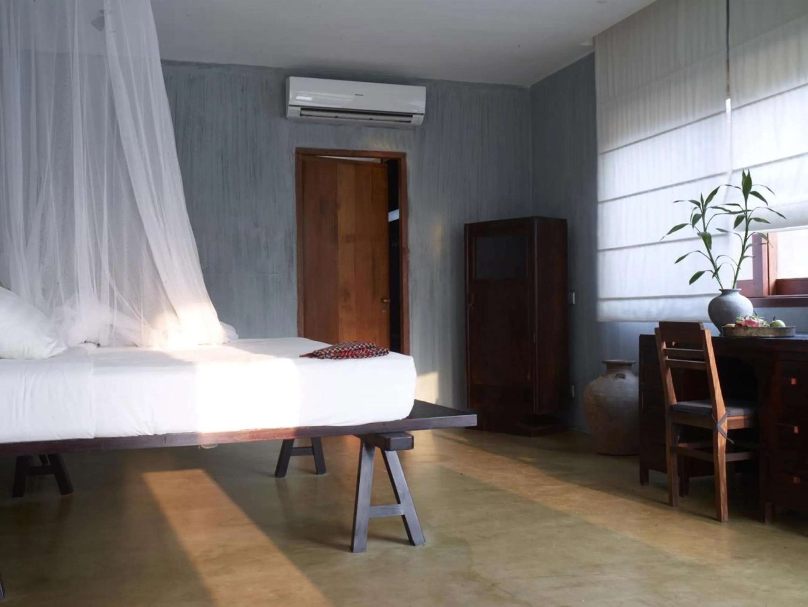 Bed in Knai Bang Chatt Resort