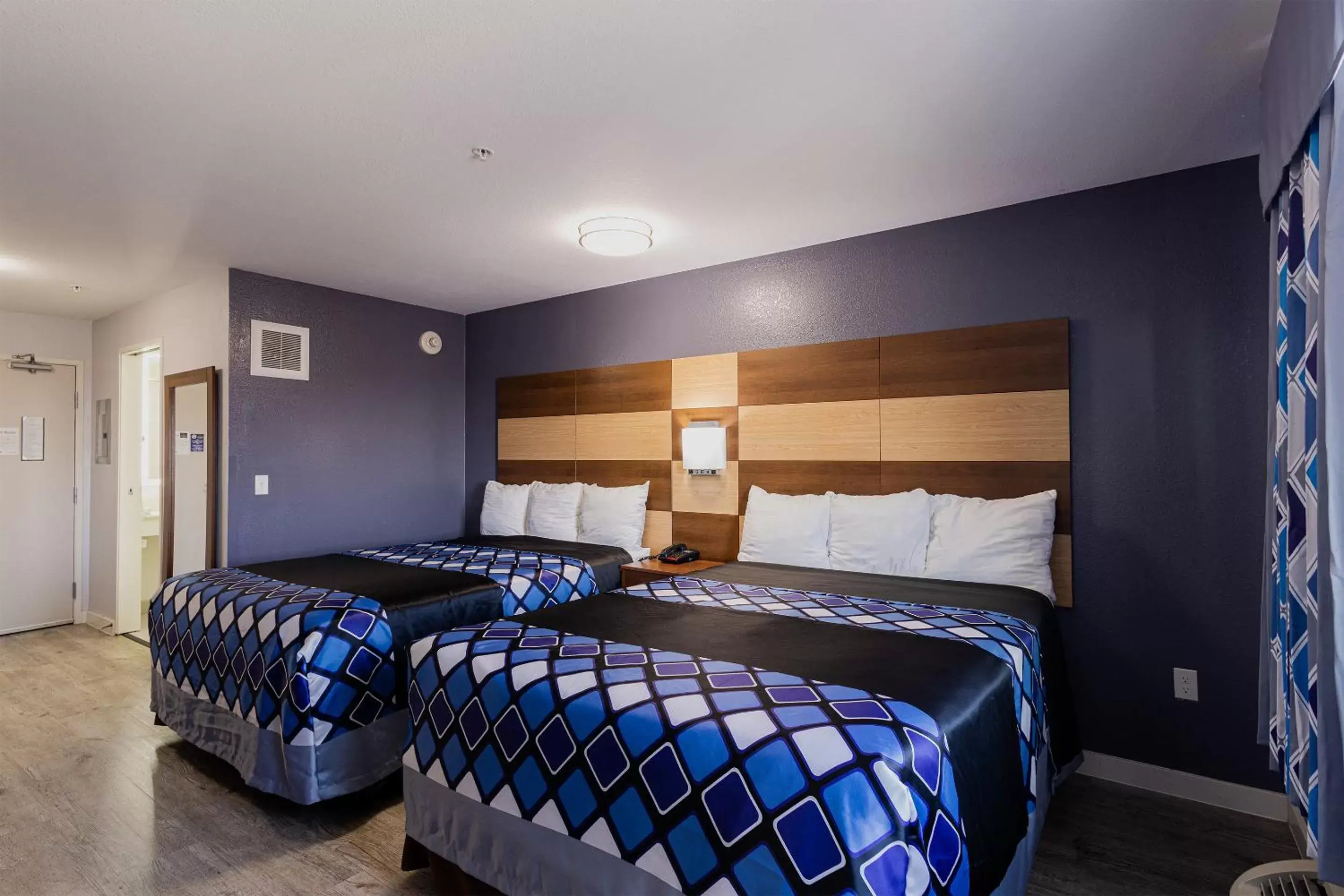 Bed in Coratel Inn & Suites by Jasper Inver Grove Heights