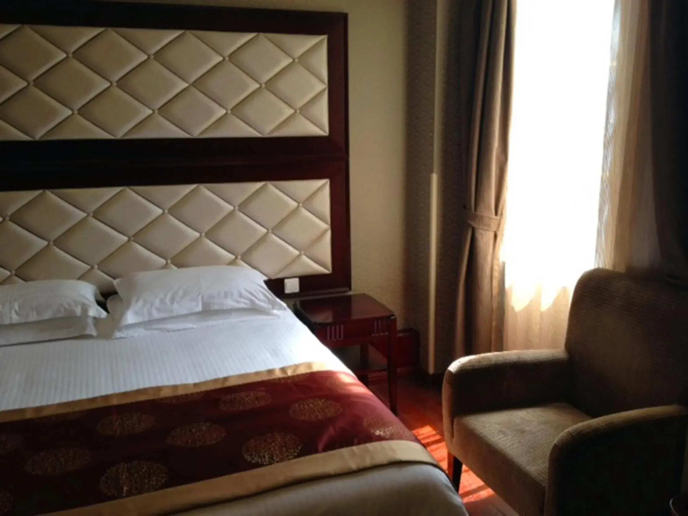 Bed in Seventh Heaven Hotel