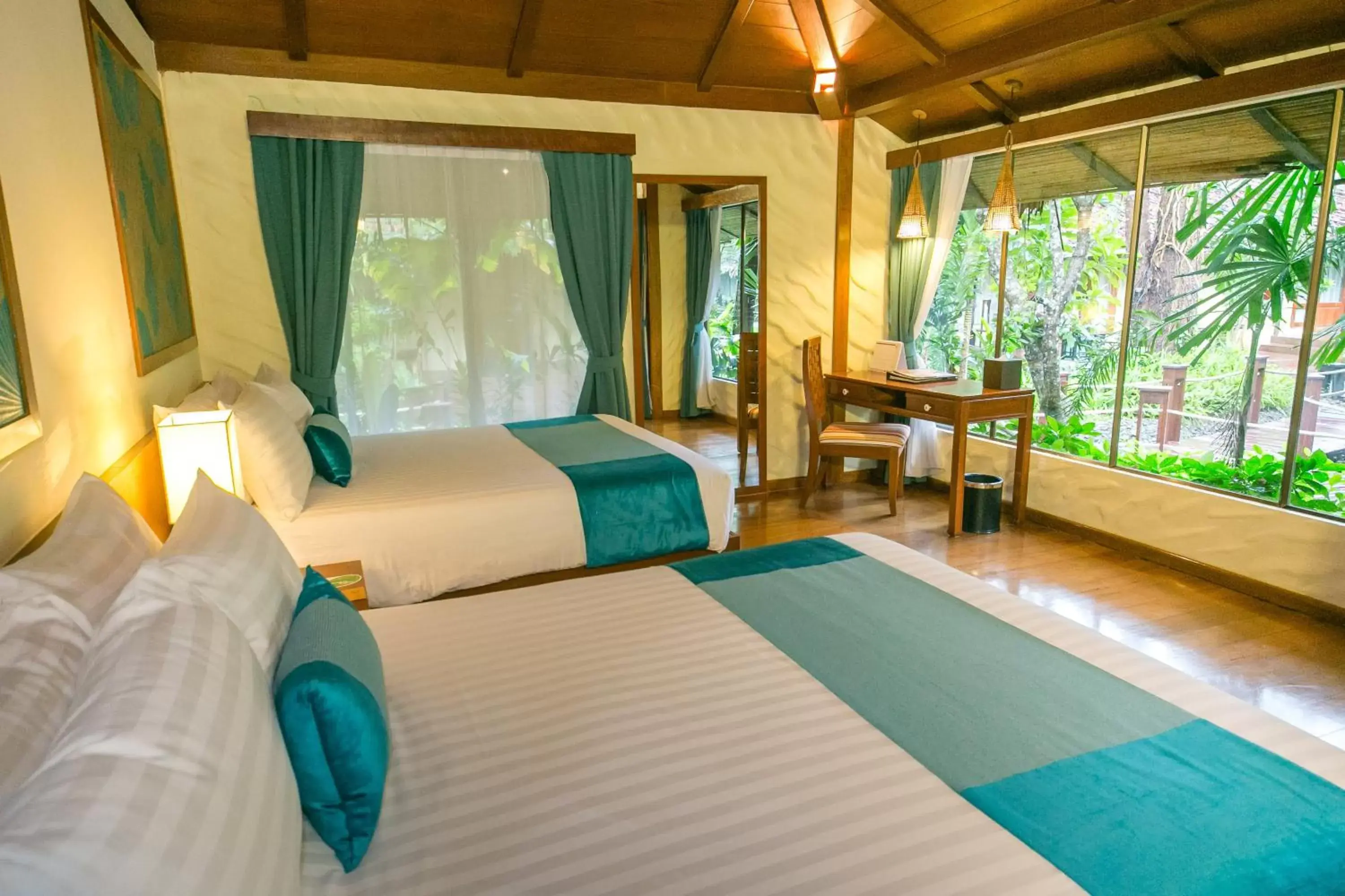 Photo of the whole room, Bed in Centara Koh Chang Tropicana Resort