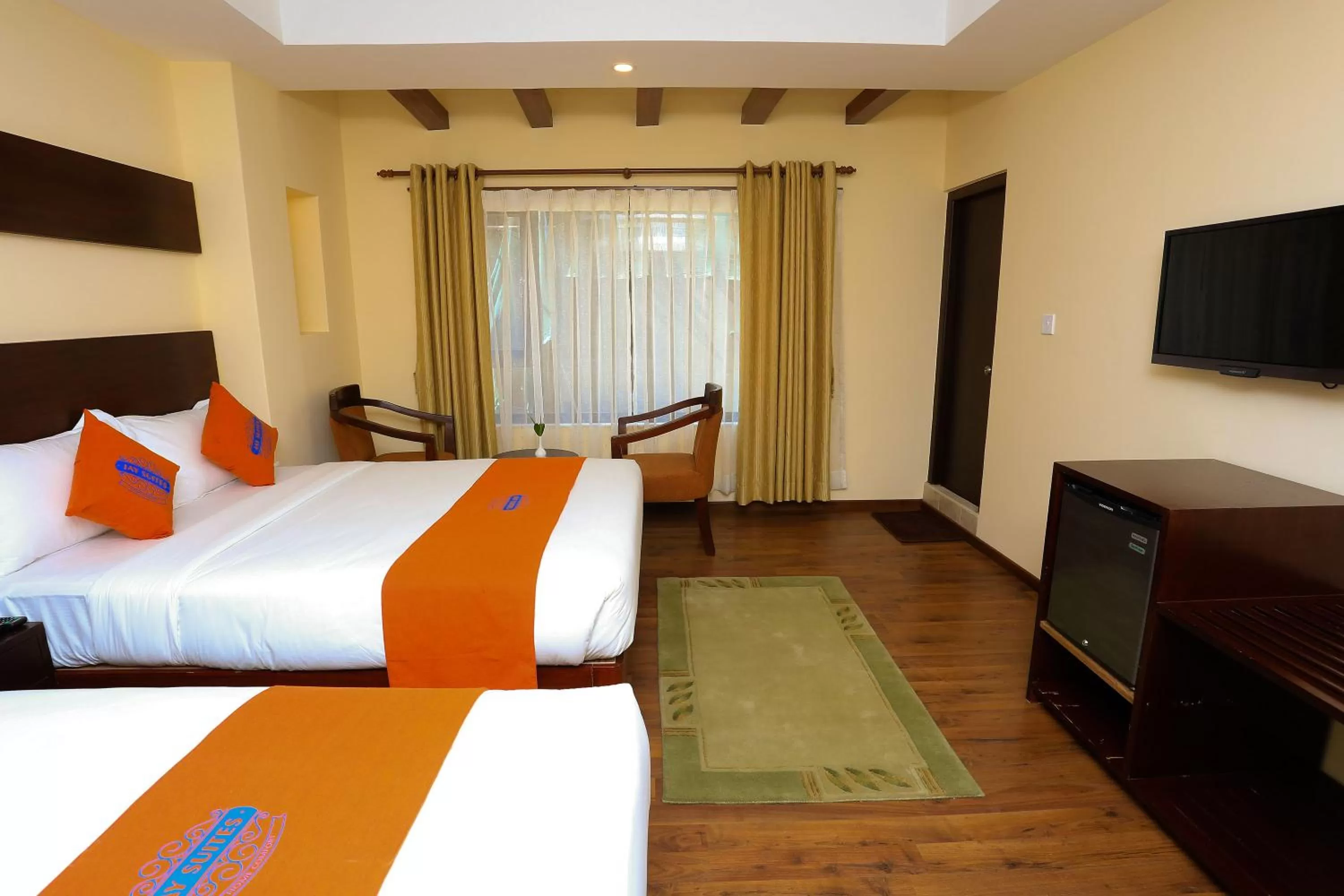 Bed in Hotel Jay Suites