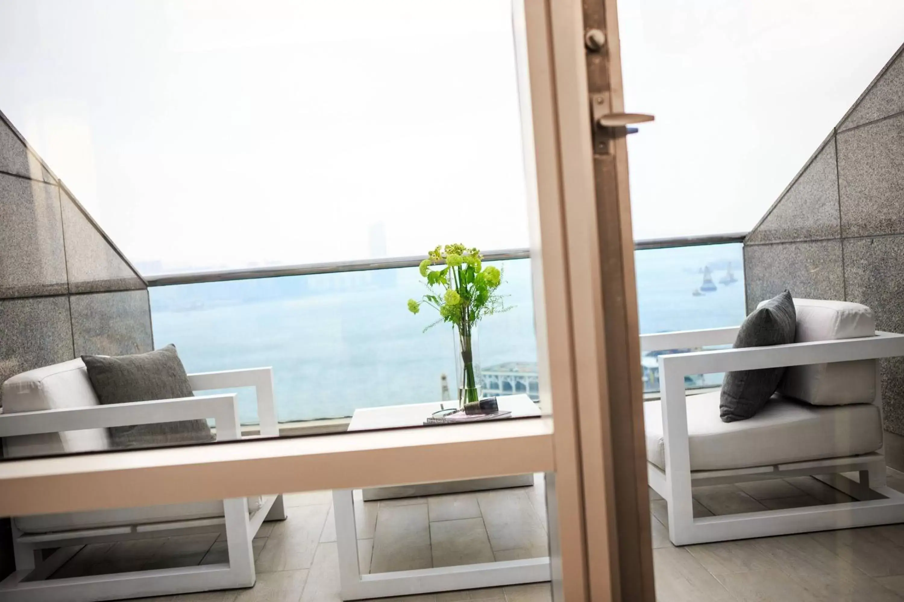 Photo of the whole room, Balcony/Terrace in Renaissance Hong Kong Harbour View Hotel
