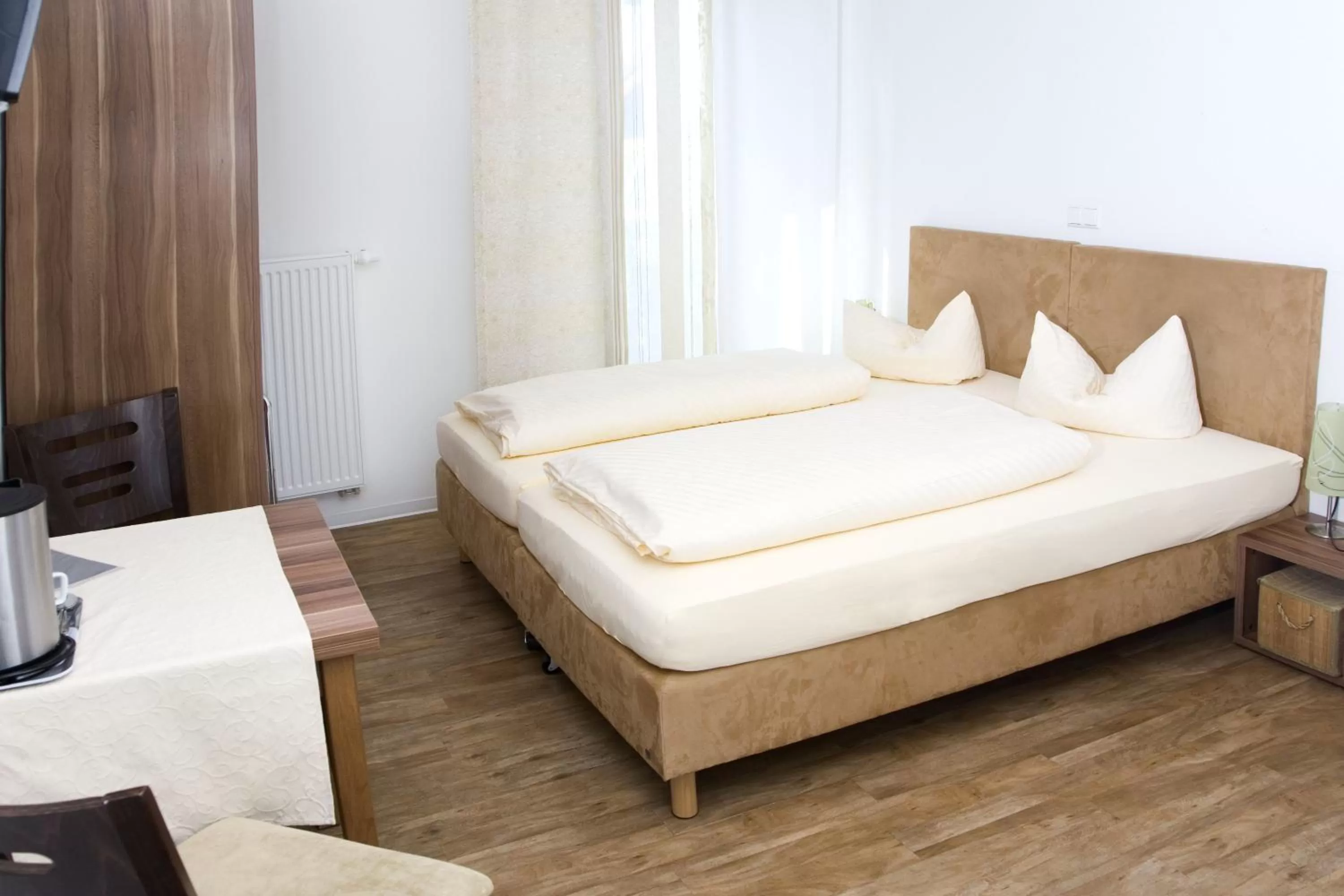 Bed in Gästehaus und Fewo Lamm Garni