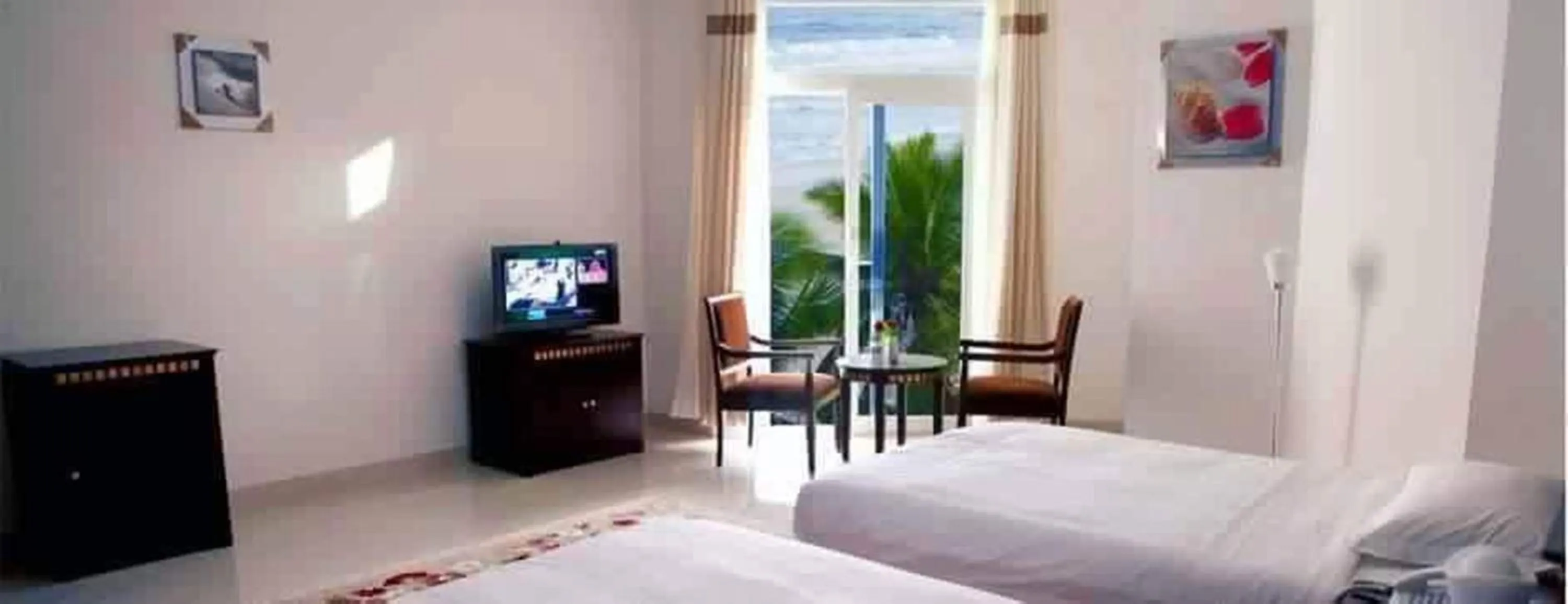 Photo of the whole room, Bed in Beach Resort Salalah