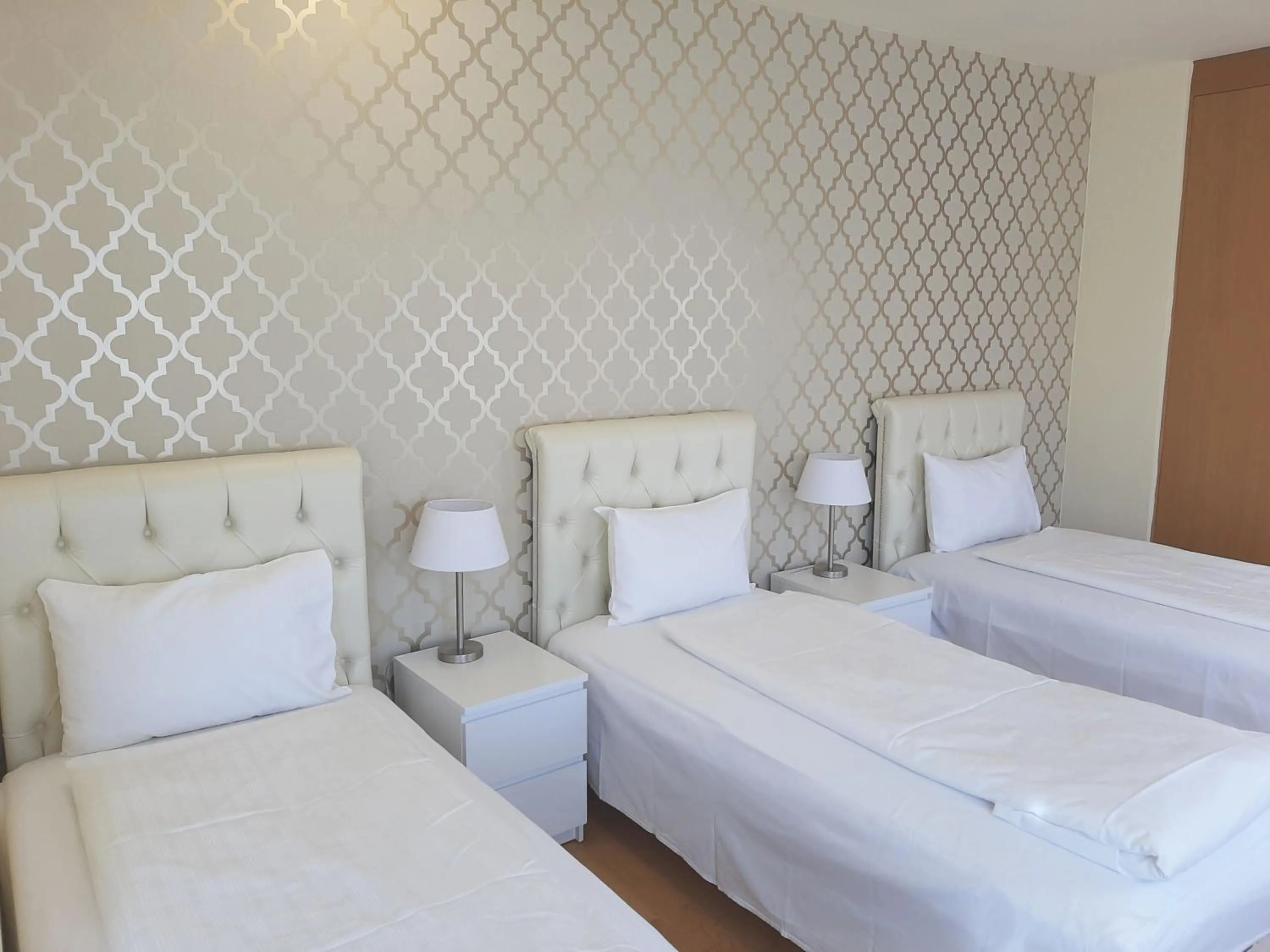 Bed in Trendy Deluxe Apartments