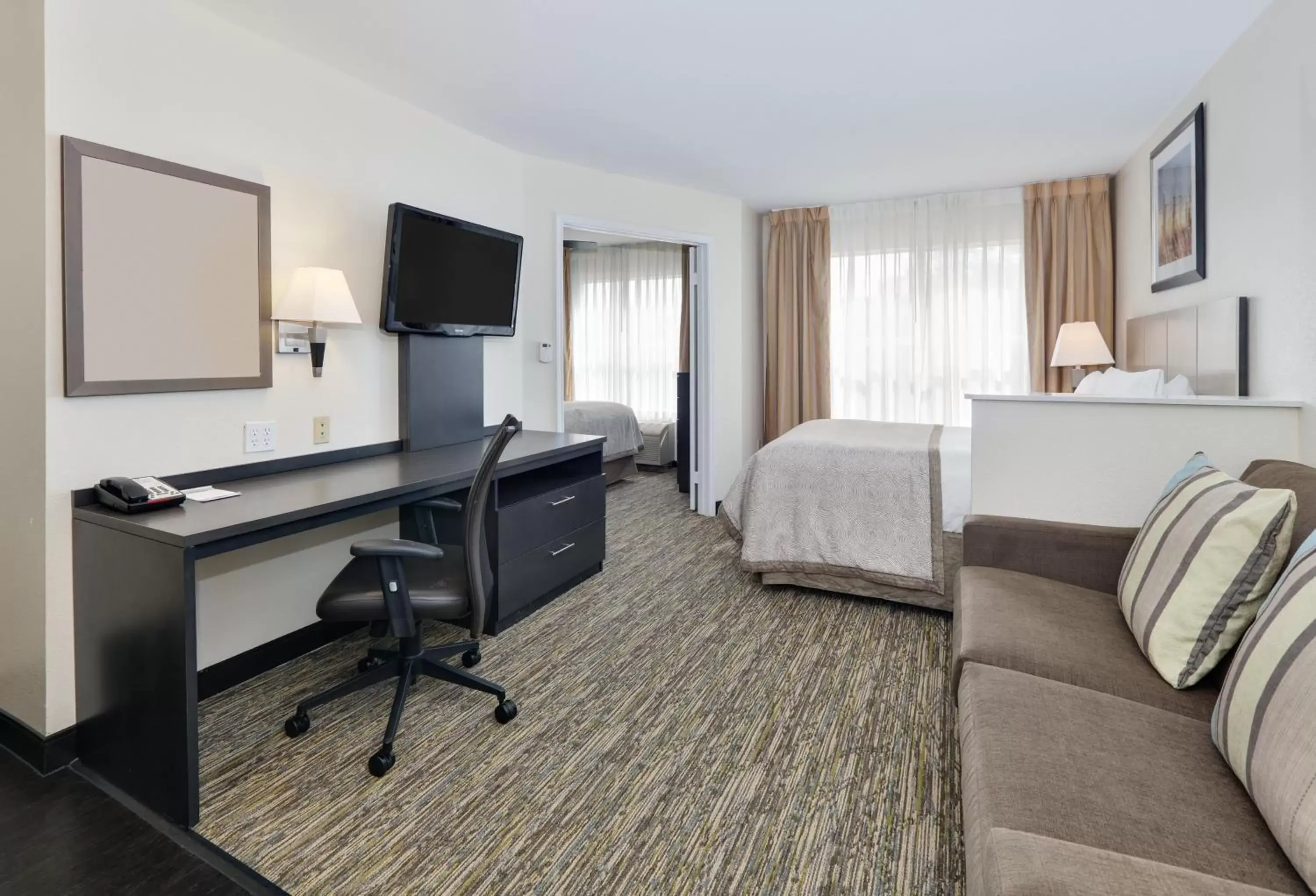 Photo of the whole room, TV/Entertainment Center in Candlewood Suites Dallas Market Center-Love Field, an IHG Hotel