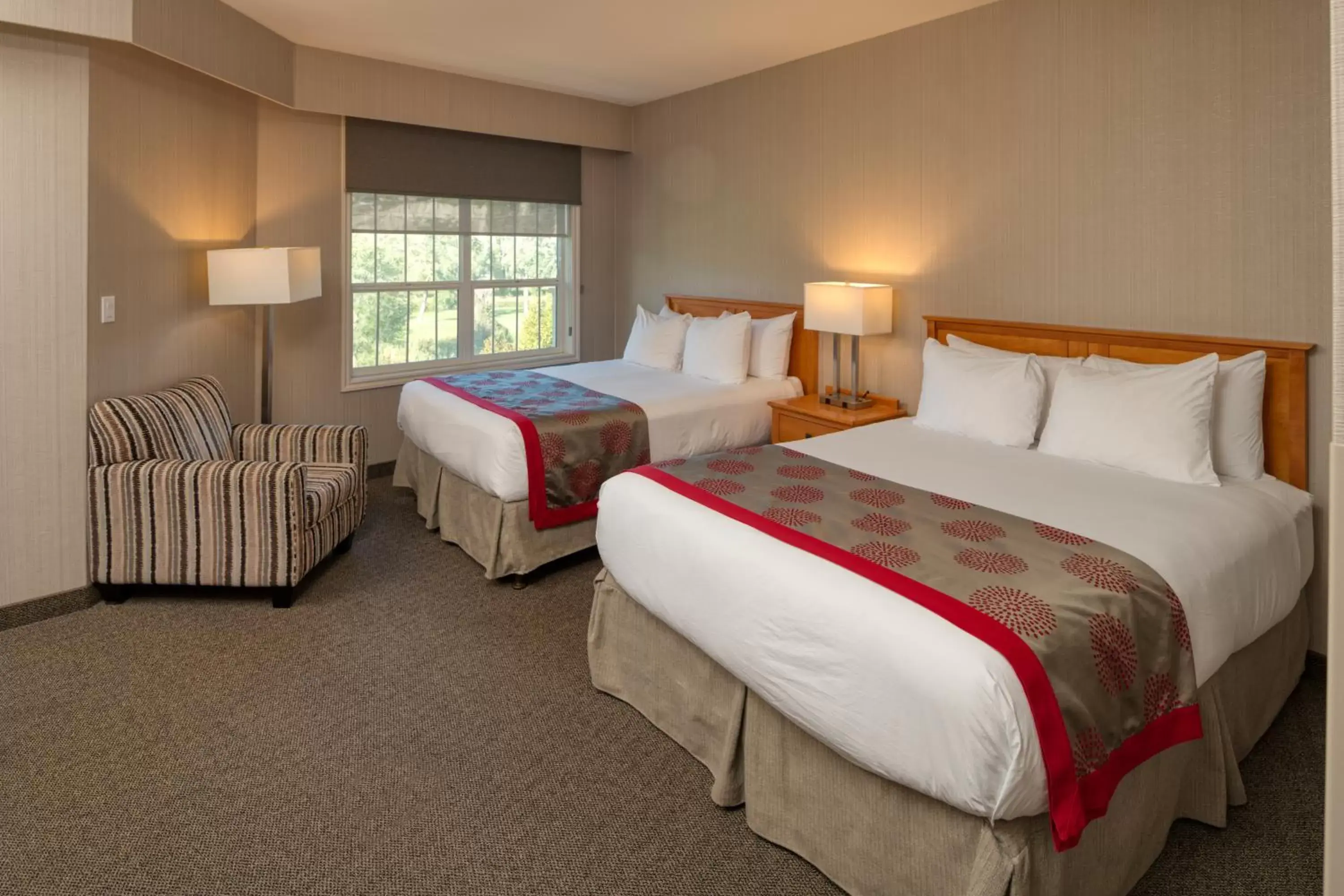 Bed in Ramada by Wyndham Penticton Hotel & Suites