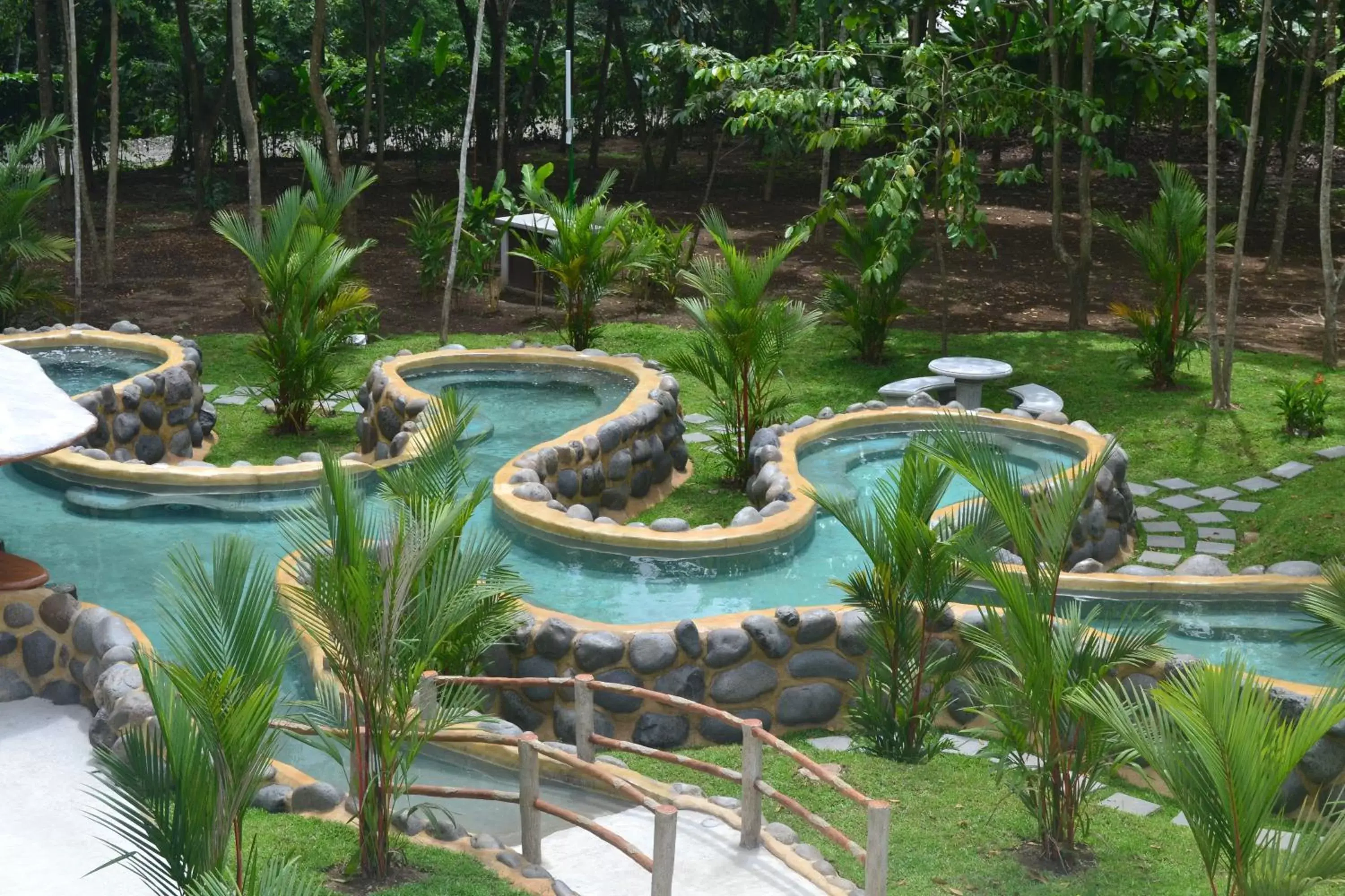 Hot Spring Bath, Swimming Pool in Volcano Lodge, Hotel & Thermal Experience