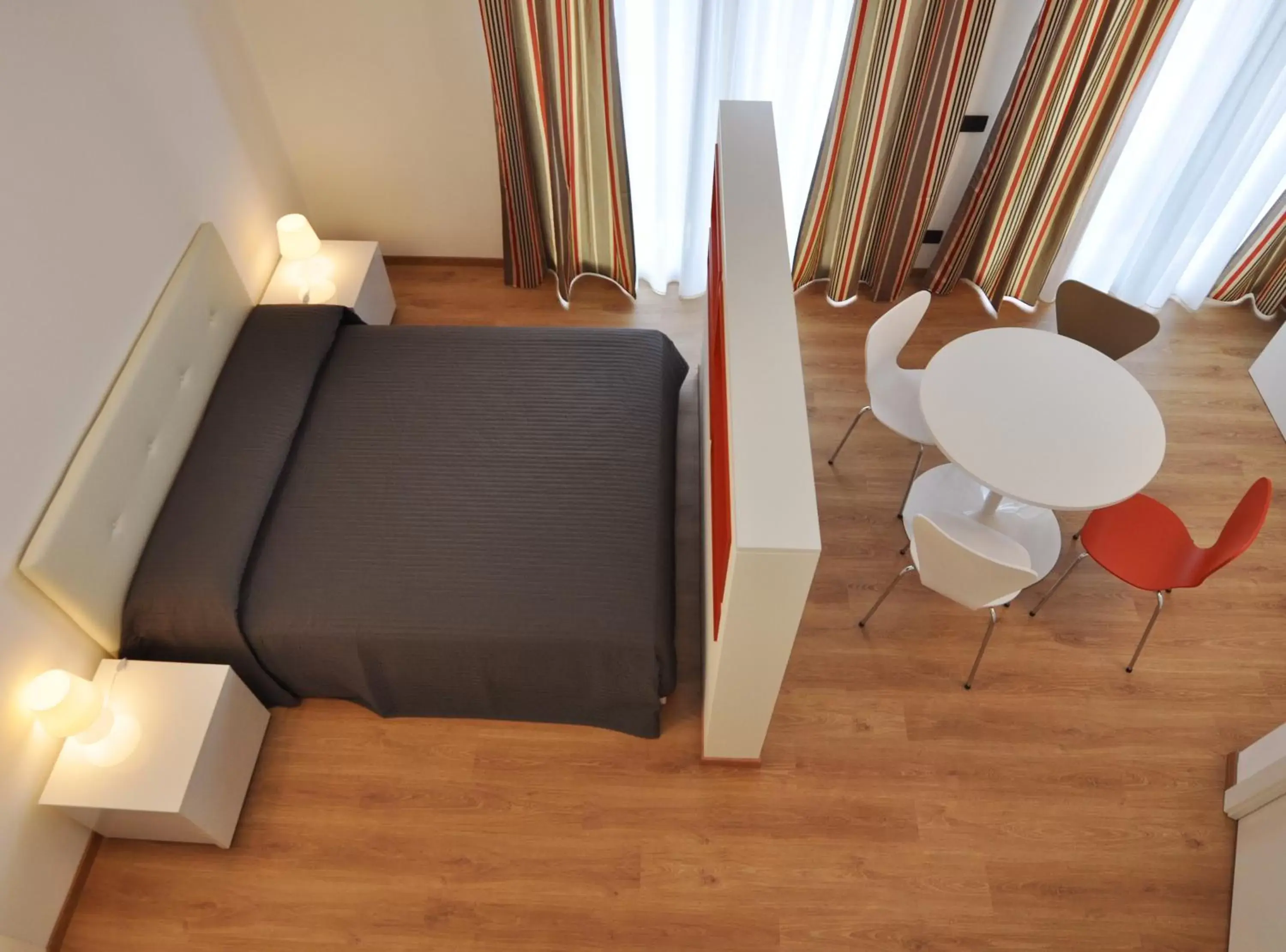 Living room, Bed in BB Hotels Aparthotel Isola
