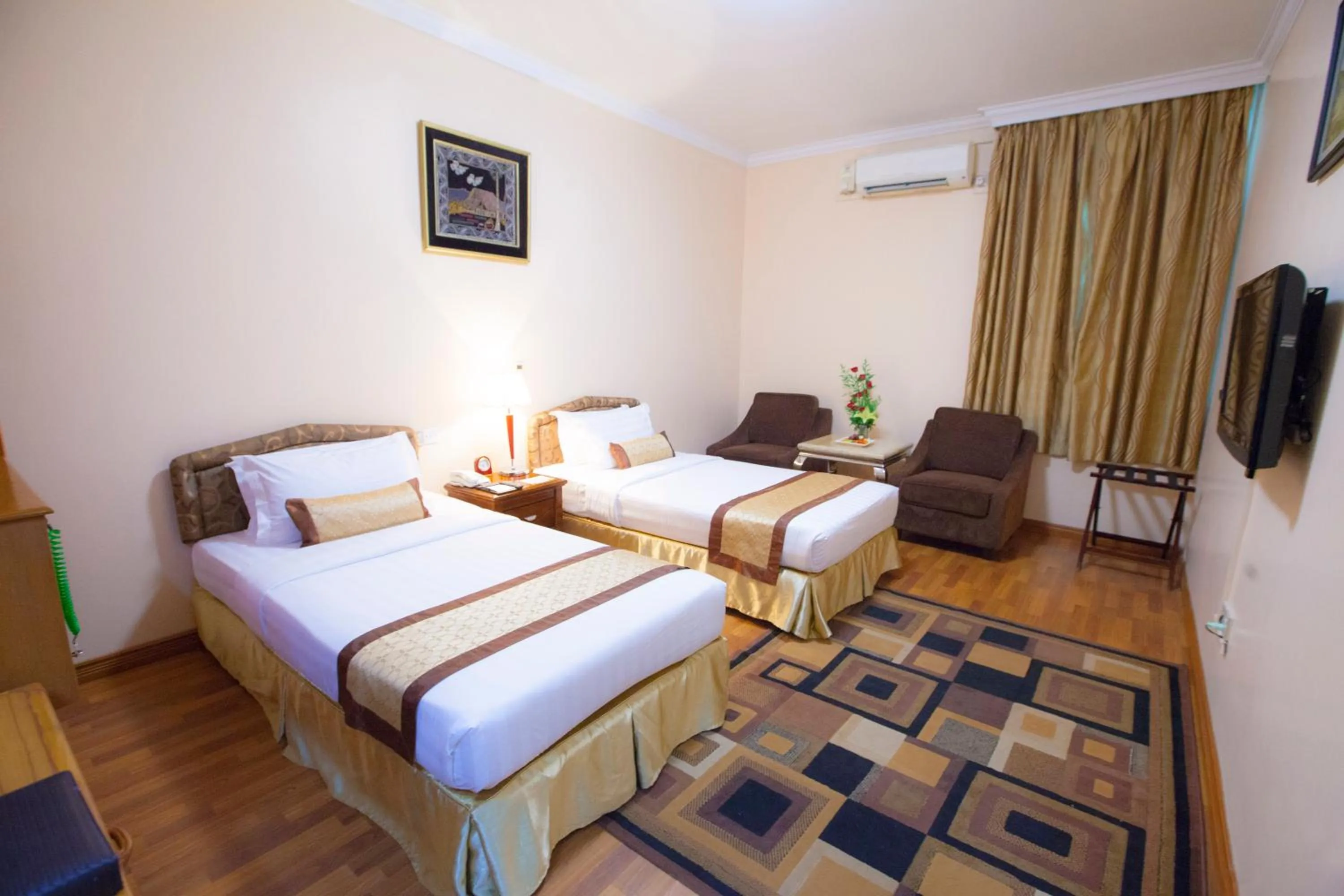 Bed in Grand Palace Hotel